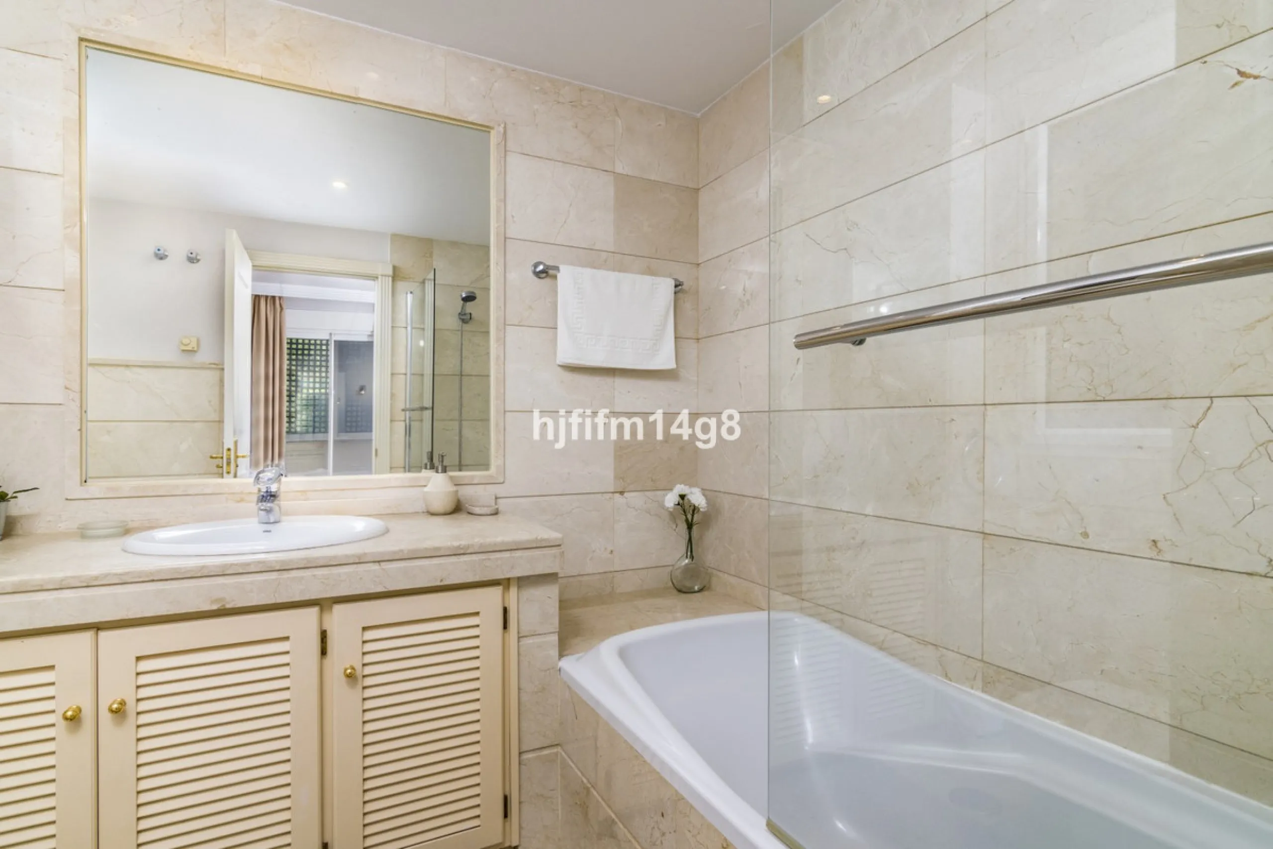 Discover this elegant two-bedroom elevated ground floor apartment for sale in the sought-after Albatross Hill complex, nestled in the scenic hills of Nueva Andalucía. This exclusive gated community offers a peaceful, secure lifestyle with outstanding amen