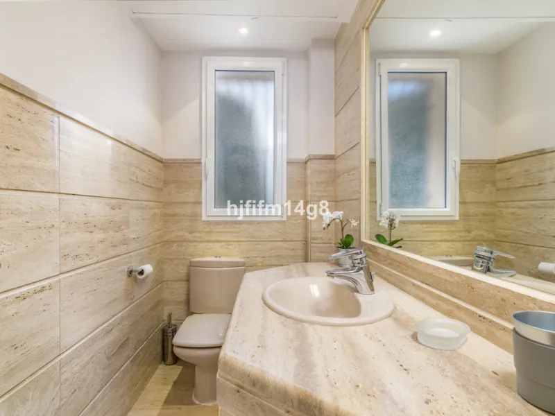 Discover this elegant two-bedroom elevated ground floor apartment for sale in the sought-after Albatross Hill complex, nestled in the scenic hills of Nueva Andalucía. This exclusive gated community offers a peaceful, secure lifestyle with outstanding amen