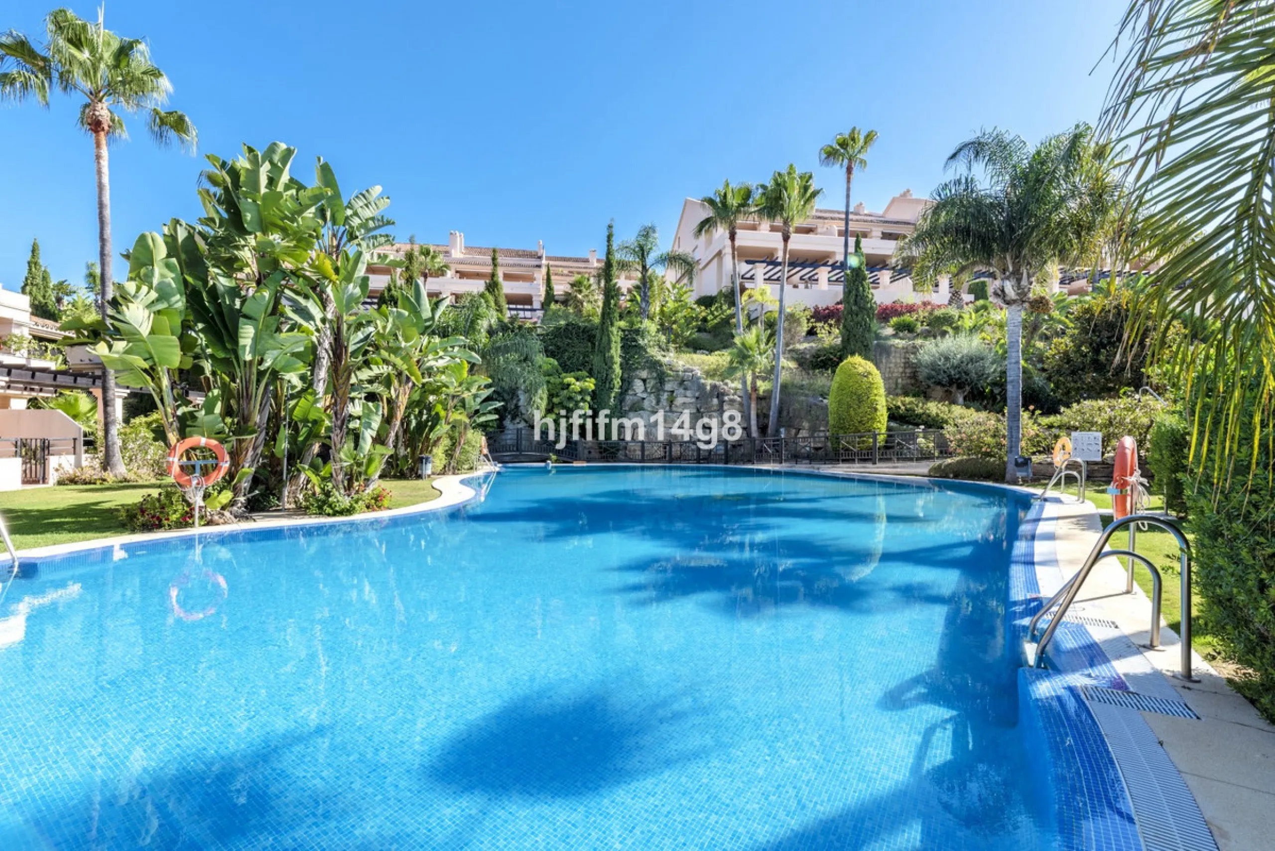 Discover this elegant two-bedroom elevated ground floor apartment for sale in the sought-after Albatross Hill complex, nestled in the scenic hills of Nueva Andalucía. This exclusive gated community offers a peaceful, secure lifestyle with outstanding amen