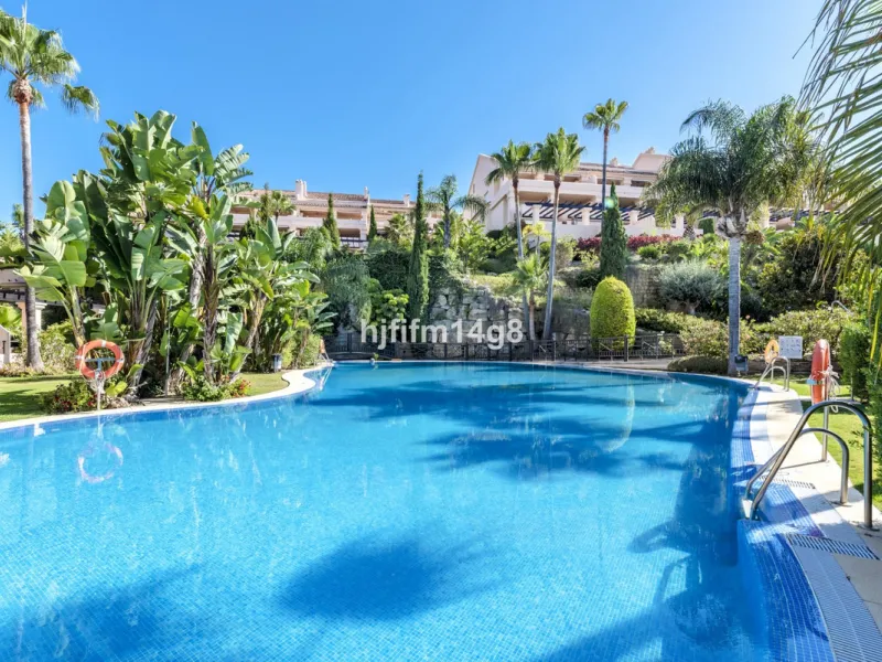 Discover this elegant two-bedroom elevated ground floor apartment for sale in the sought-after Albatross Hill complex, nestled in the scenic hills of Nueva Andalucía. This exclusive gated community offers a peaceful, secure lifestyle with outstanding amen
