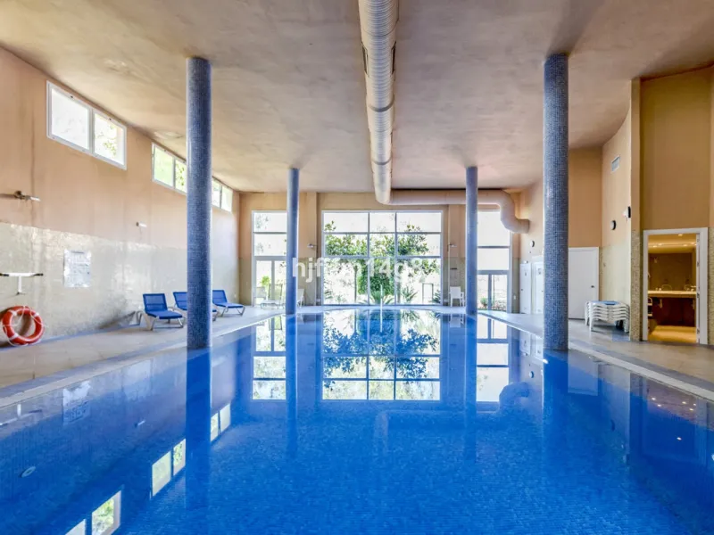Discover this elegant two-bedroom elevated ground floor apartment for sale in the sought-after Albatross Hill complex, nestled in the scenic hills of Nueva Andalucía. This exclusive gated community offers a peaceful, secure lifestyle with outstanding amen
