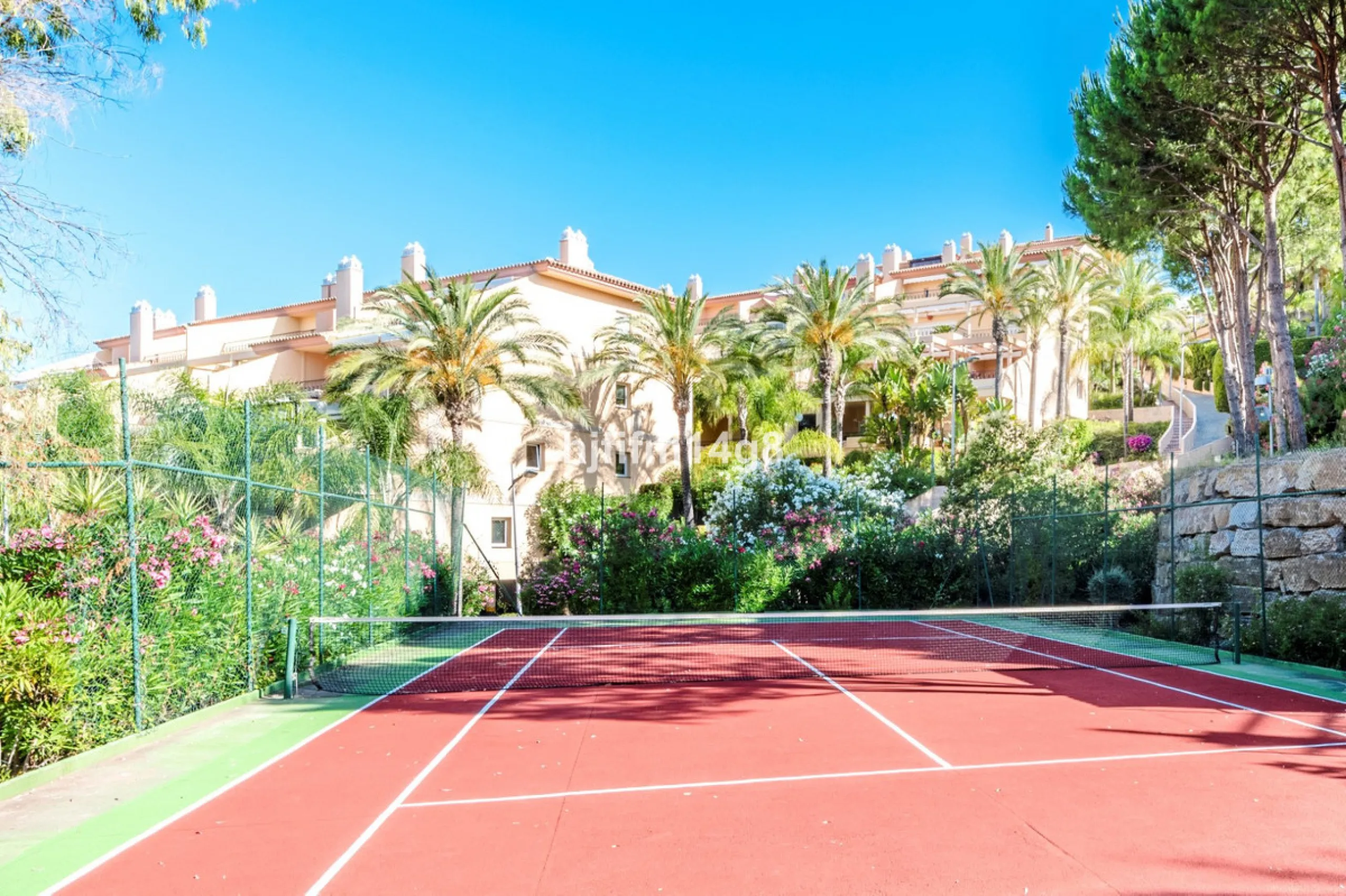Discover this elegant two-bedroom elevated ground floor apartment for sale in the sought-after Albatross Hill complex, nestled in the scenic hills of Nueva Andalucía. This exclusive gated community offers a peaceful, secure lifestyle with outstanding amen