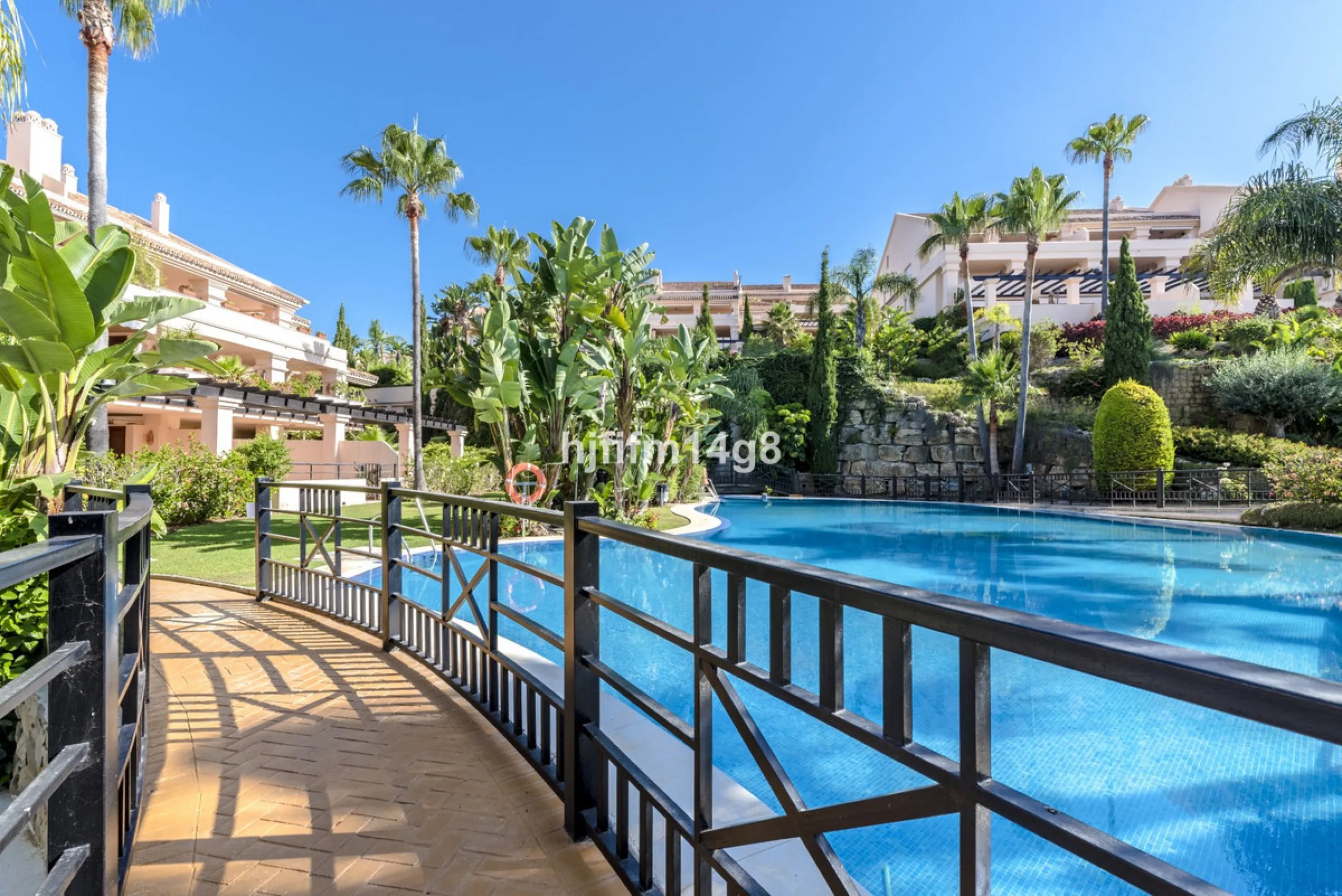 Discover this elegant two-bedroom elevated ground floor apartment for sale in the sought-after Albatross Hill complex, nestled in the scenic hills of Nueva Andalucía. This exclusive gated community offers a peaceful, secure lifestyle with outstanding amen
