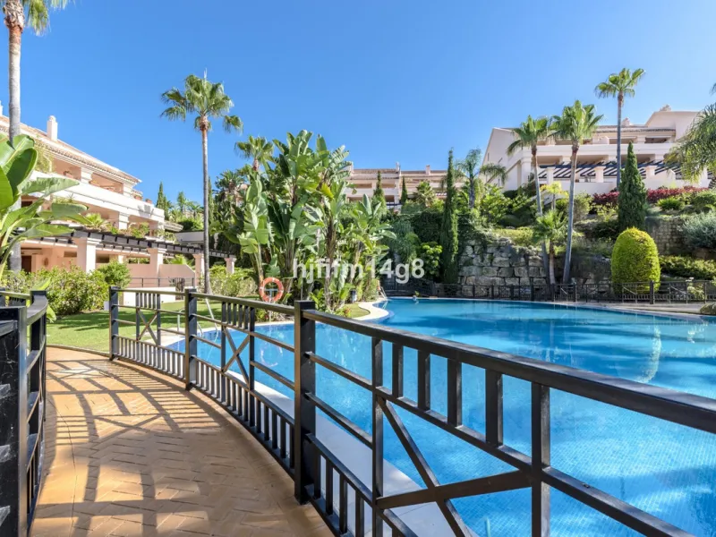 Discover this elegant two-bedroom elevated ground floor apartment for sale in the sought-after Albatross Hill complex, nestled in the scenic hills of Nueva Andalucía. This exclusive gated community offers a peaceful, secure lifestyle with outstanding amen