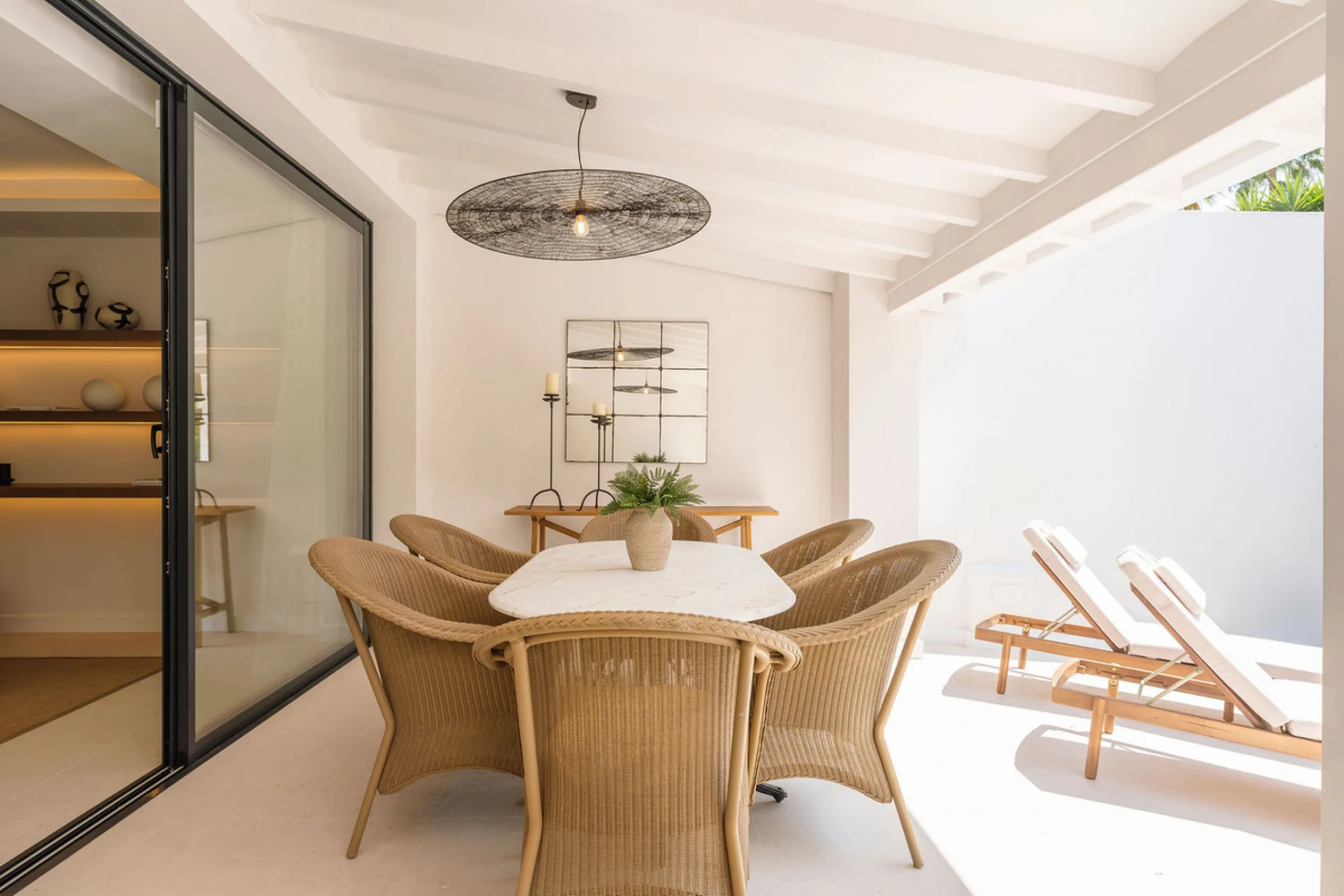Beautifully designed three-story townhouse for sale in Nueva Andalucía's Golf Valley. Recently renovated, the property blends Mediterranean charm with the clean lines and functionality of modern living. Its architecture captures the lifestyle expectations
