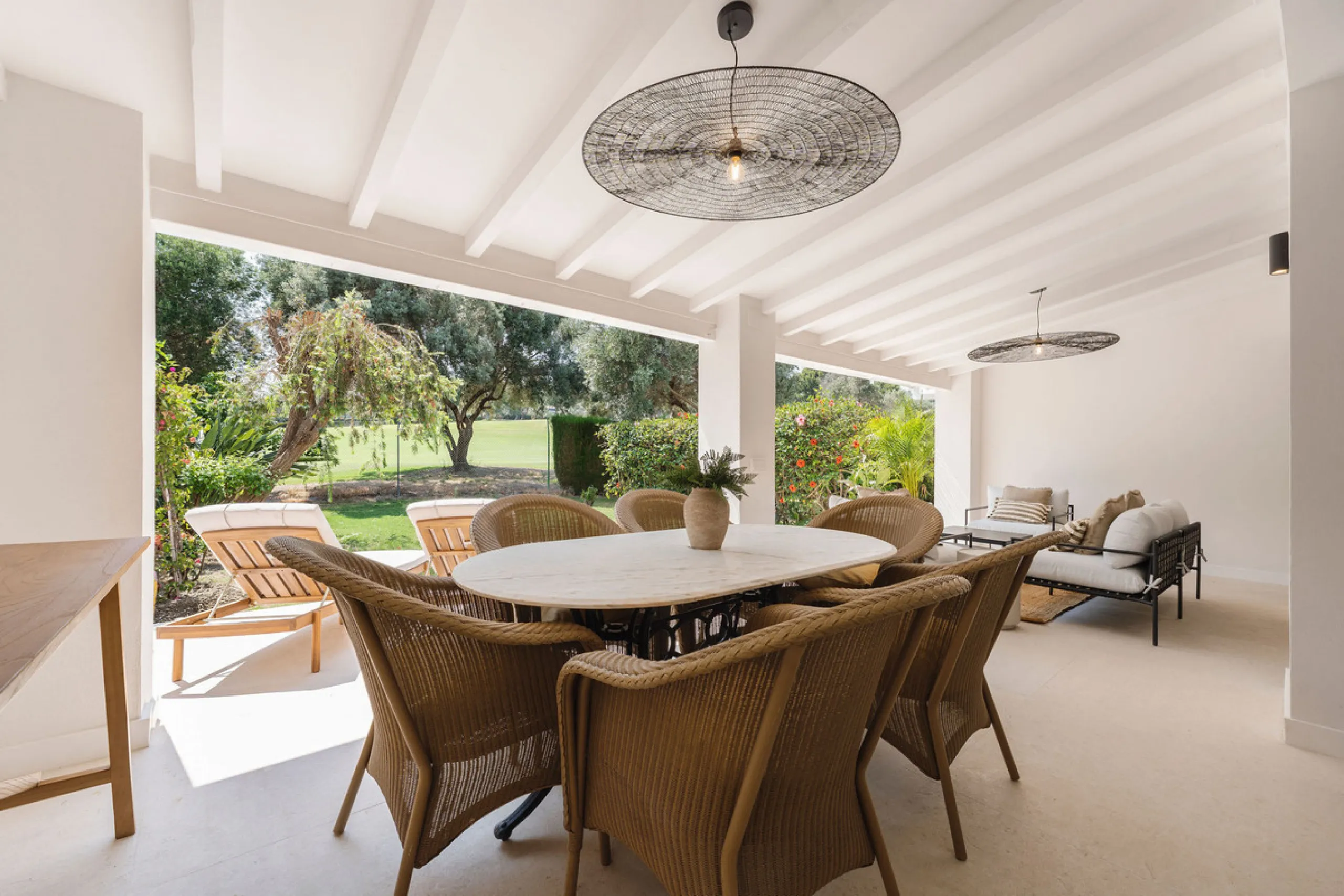 Beautifully designed three-story townhouse for sale in Nueva Andalucía's Golf Valley. Recently renovated, the property blends Mediterranean charm with the clean lines and functionality of modern living. Its architecture captures the lifestyle expectations