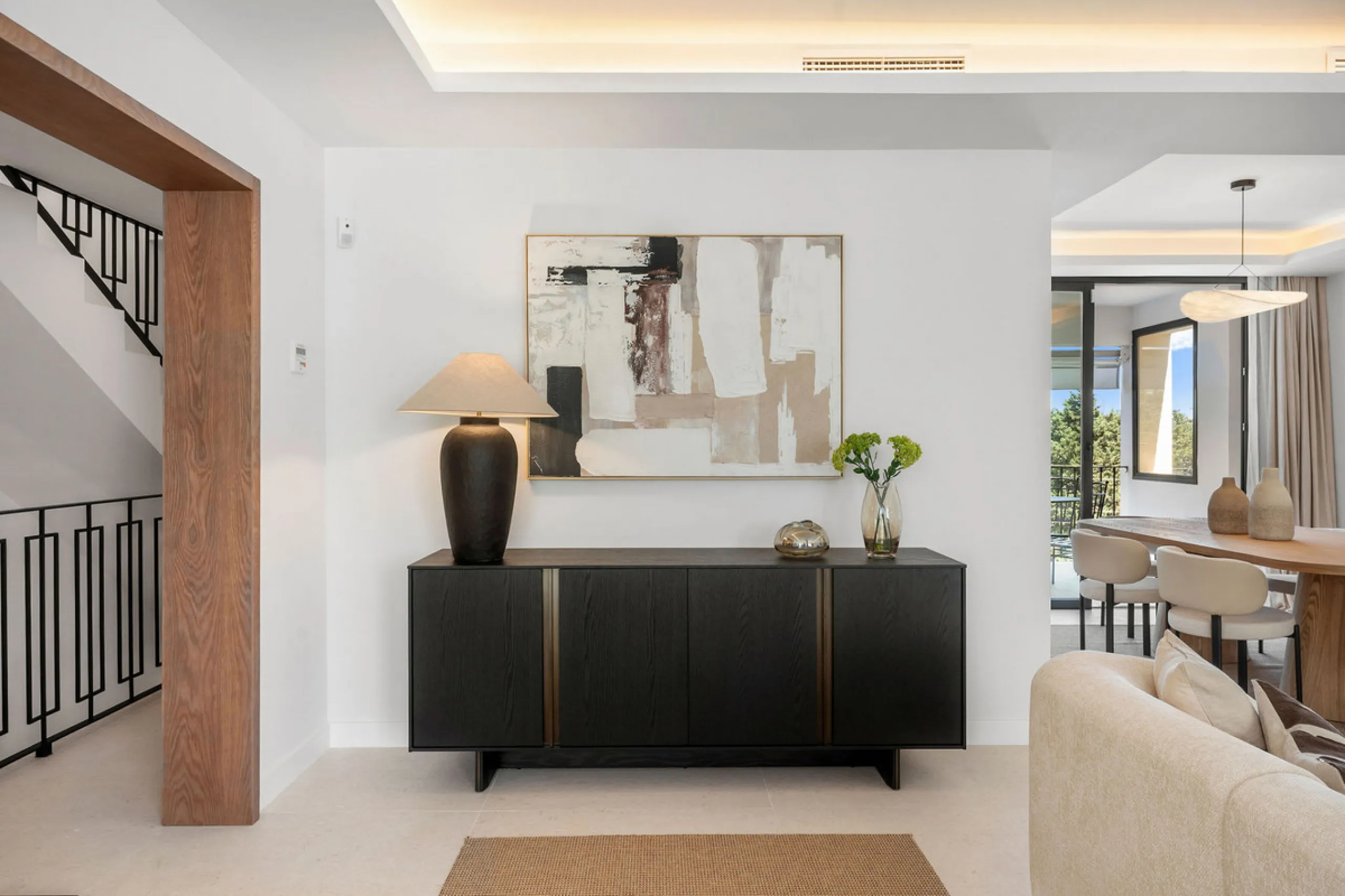 Beautifully designed three-story townhouse for sale in Nueva Andalucía's Golf Valley. Recently renovated, the property blends Mediterranean charm with the clean lines and functionality of modern living. Its architecture captures the lifestyle expectations