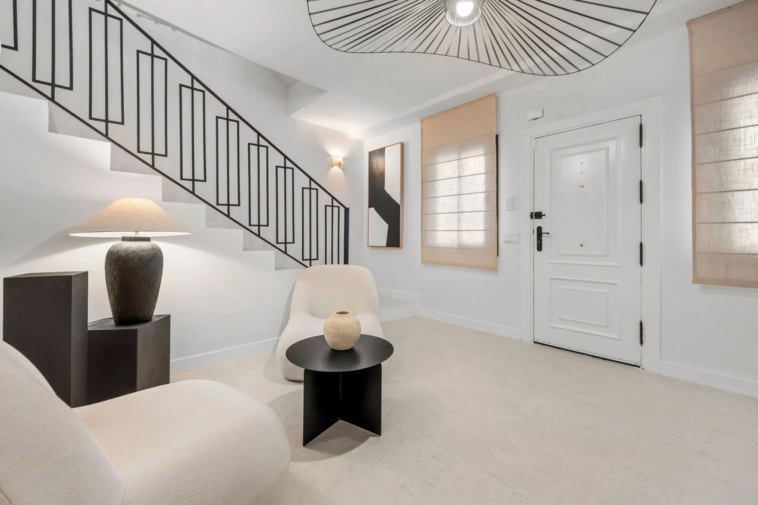Beautifully designed three-story townhouse for sale in Nueva Andalucía's Golf Valley. Recently renovated, the property blends Mediterranean charm with the clean lines and functionality of modern living. Its architecture captures the lifestyle expectations