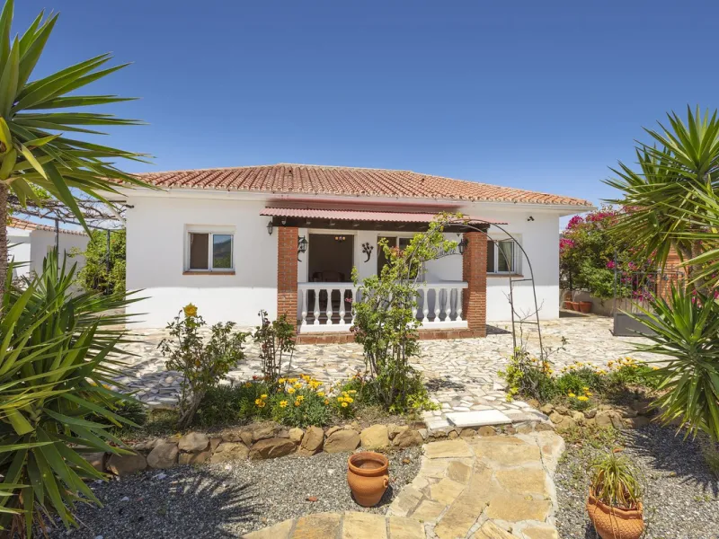 This finca set in an elevated position has impressive mountain views all around it.  The garden is split into different areas each with its own beautiful vibe. Stylish barbecue area by the pool is great for relaxing and welcoming guests.  Main house has t