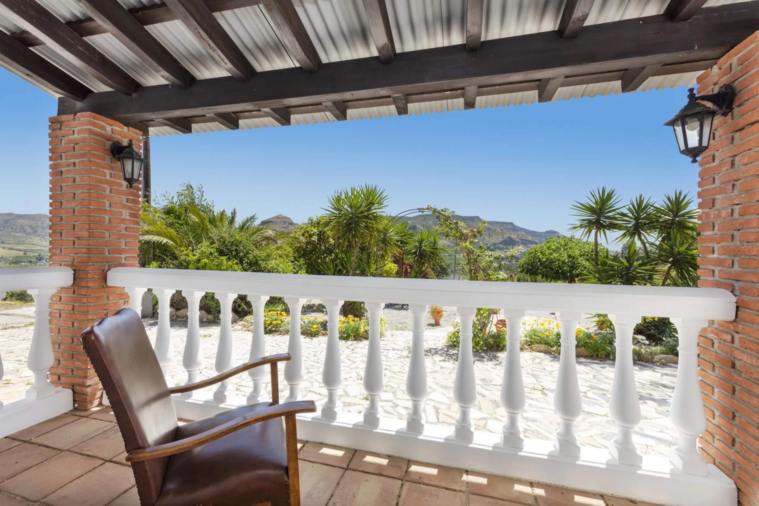 This finca set in an elevated position has impressive mountain views all around it.  The garden is split into different areas each with its own beautiful vibe. Stylish barbecue area by the pool is great for relaxing and welcoming guests.  Main house has t