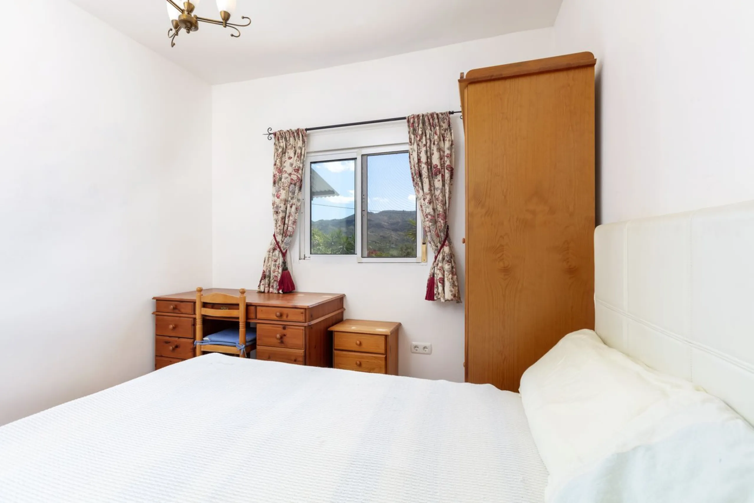 This finca set in an elevated position has impressive mountain views all around it.  The garden is split into different areas each with its own beautiful vibe. Stylish barbecue area by the pool is great for relaxing and welcoming guests.  Main house has t