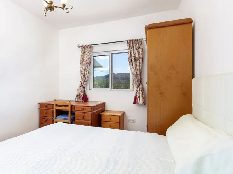 This finca set in an elevated position has impressive mountain views all around it.  The garden is split into different areas each with its own beautiful vibe. Stylish barbecue area by the pool is great for relaxing and welcoming guests.  Main house has t