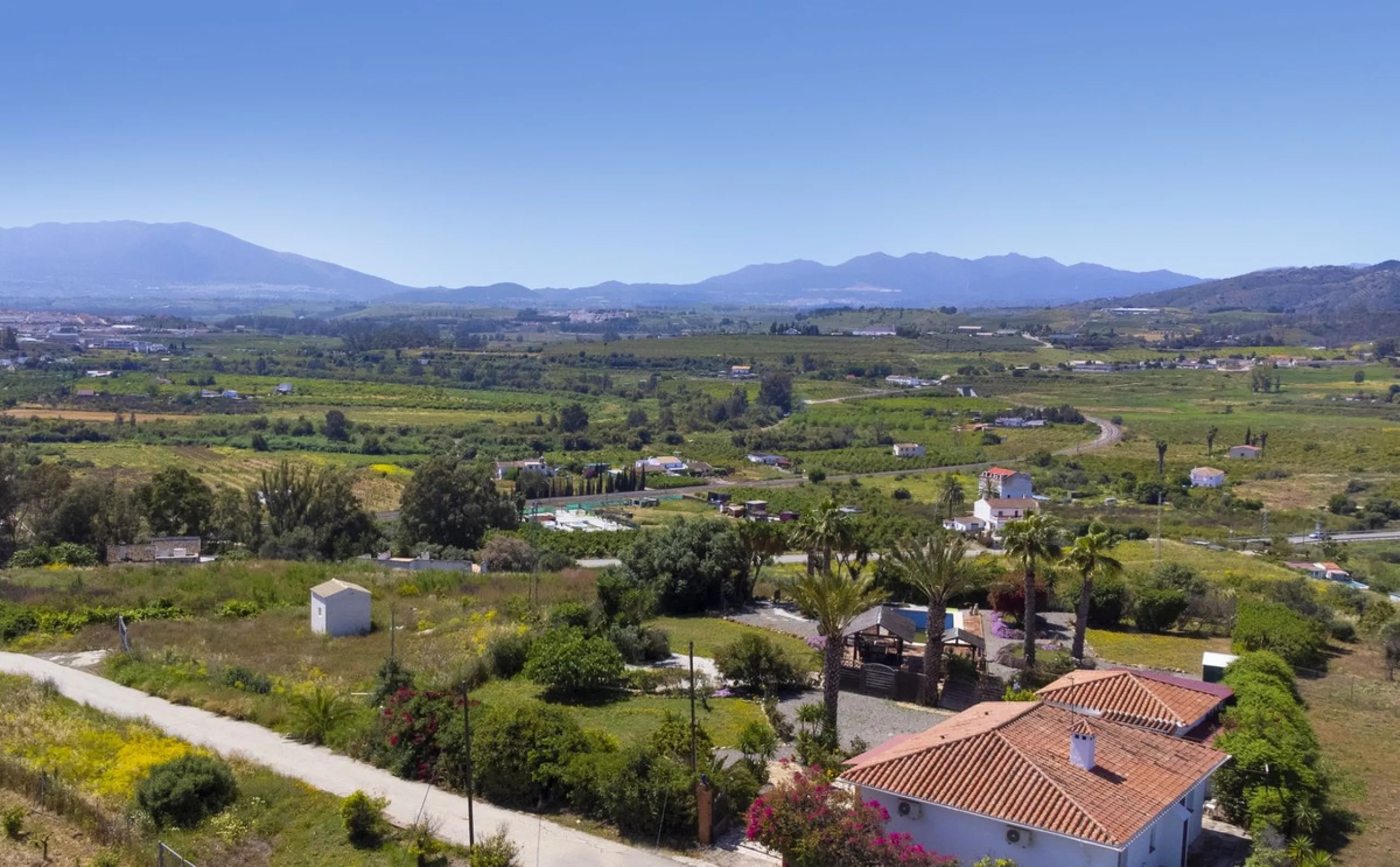This finca set in an elevated position has impressive mountain views all around it.  The garden is split into different areas each with its own beautiful vibe. Stylish barbecue area by the pool is great for relaxing and welcoming guests.  Main house has t
