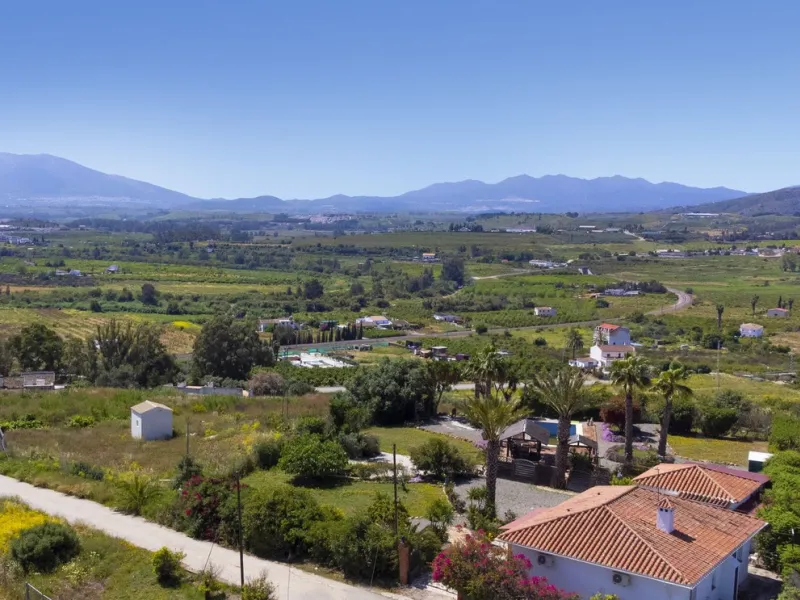 This finca set in an elevated position has impressive mountain views all around it.  The garden is split into different areas each with its own beautiful vibe. Stylish barbecue area by the pool is great for relaxing and welcoming guests.  Main house has t