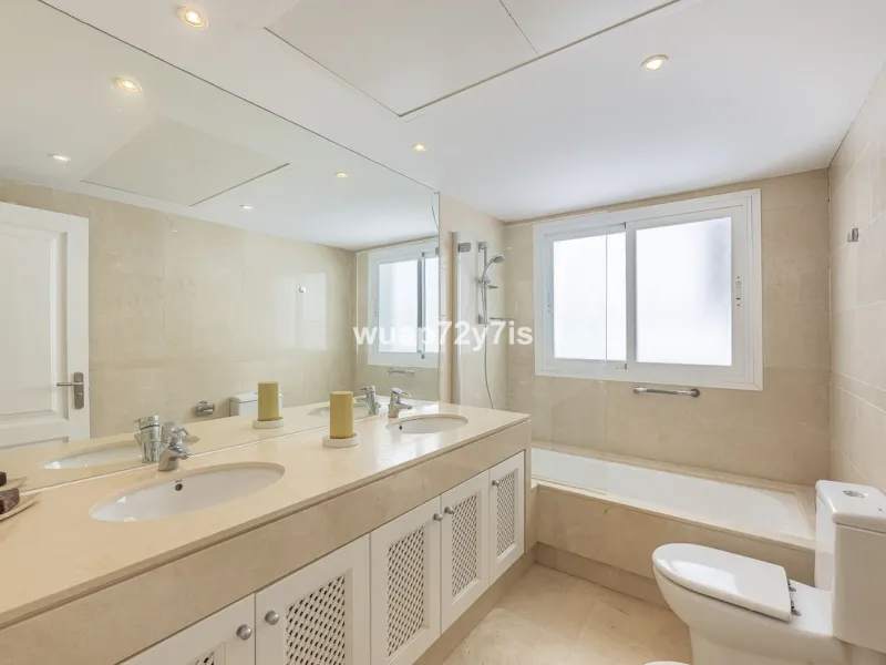 Charming Elevated Ground Floor 3-Bedroom Apartment with Sea and Garden Views – Nueva Andalucía
