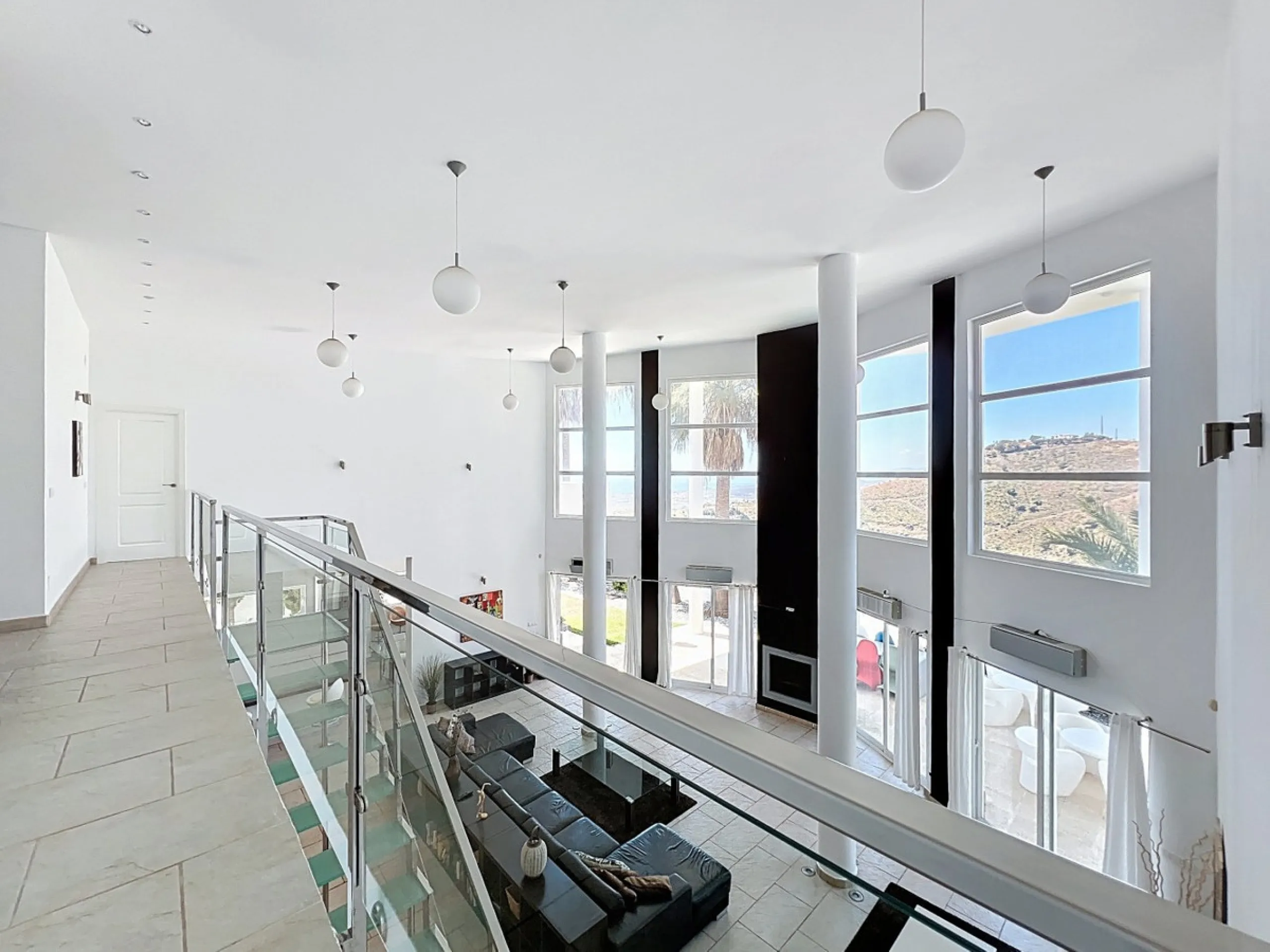 This impressive villa in Málaga, Spain, offers a harmonious blend of space, luxury, and modern design. Spanning 395.8 m2 across two floors, the property boasts 7 bedrooms and 5 bathrooms, making it ideal for large families or those who love to entertain. 