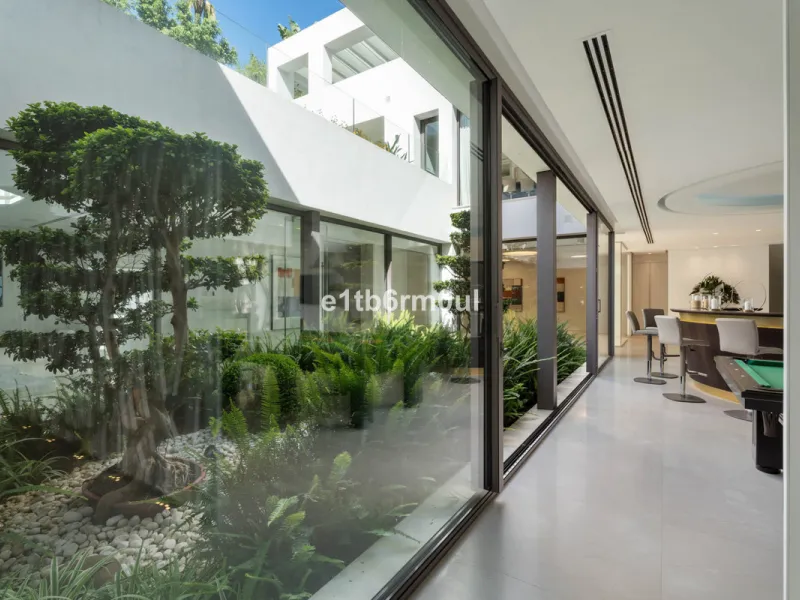 Experience the pinnacle of modern Mediterranean architecture with this brand-new designer villa nestled in the prestigious La Quinta residential enclave of Benahavís. Offering breathtaking panoramic sea and golf course views, this exquisitely crafted home