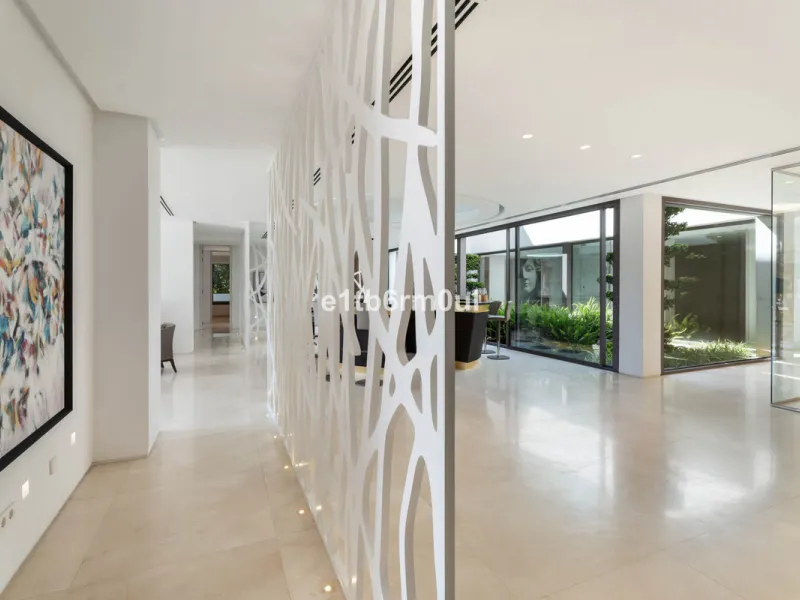 Experience the pinnacle of modern Mediterranean architecture with this brand-new designer villa nestled in the prestigious La Quinta residential enclave of Benahavís. Offering breathtaking panoramic sea and golf course views, this exquisitely crafted home