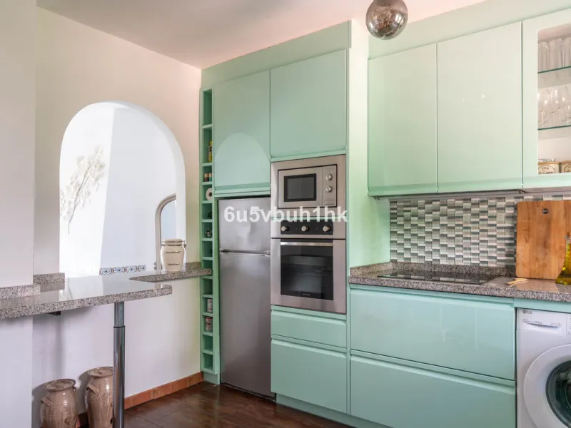 Welcome to a charming townhouse set right on the golf course in Mijas, surrounded by nature, peace, and Andalusian charm. This beautifully maintained home offers a private garden with open green views, backing directly onto a well-kept golf area, ideal fo