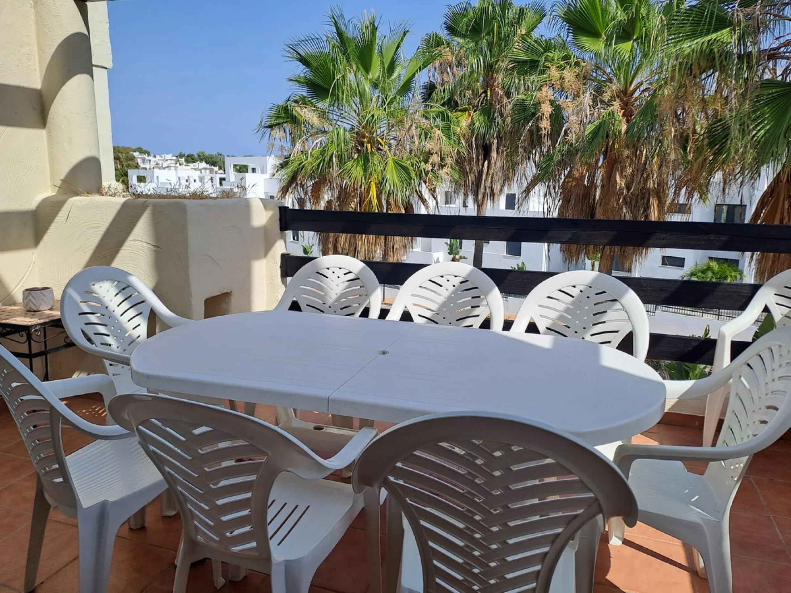 Welcome to this stunning 2-bedroom, 2-bathroom apartment, perfectly situated in a gated community that offers both comfort and convenience. As you step inside, a small hallway leads you to a spacious open-plan living room that connects to a grand solarium