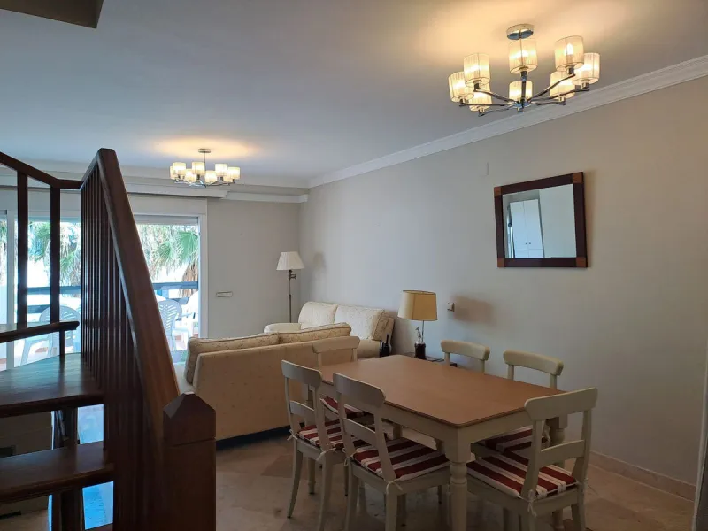 Welcome to this stunning 2-bedroom, 2-bathroom apartment, perfectly situated in a gated community that offers both comfort and convenience. As you step inside, a small hallway leads you to a spacious open-plan living room that connects to a grand solarium