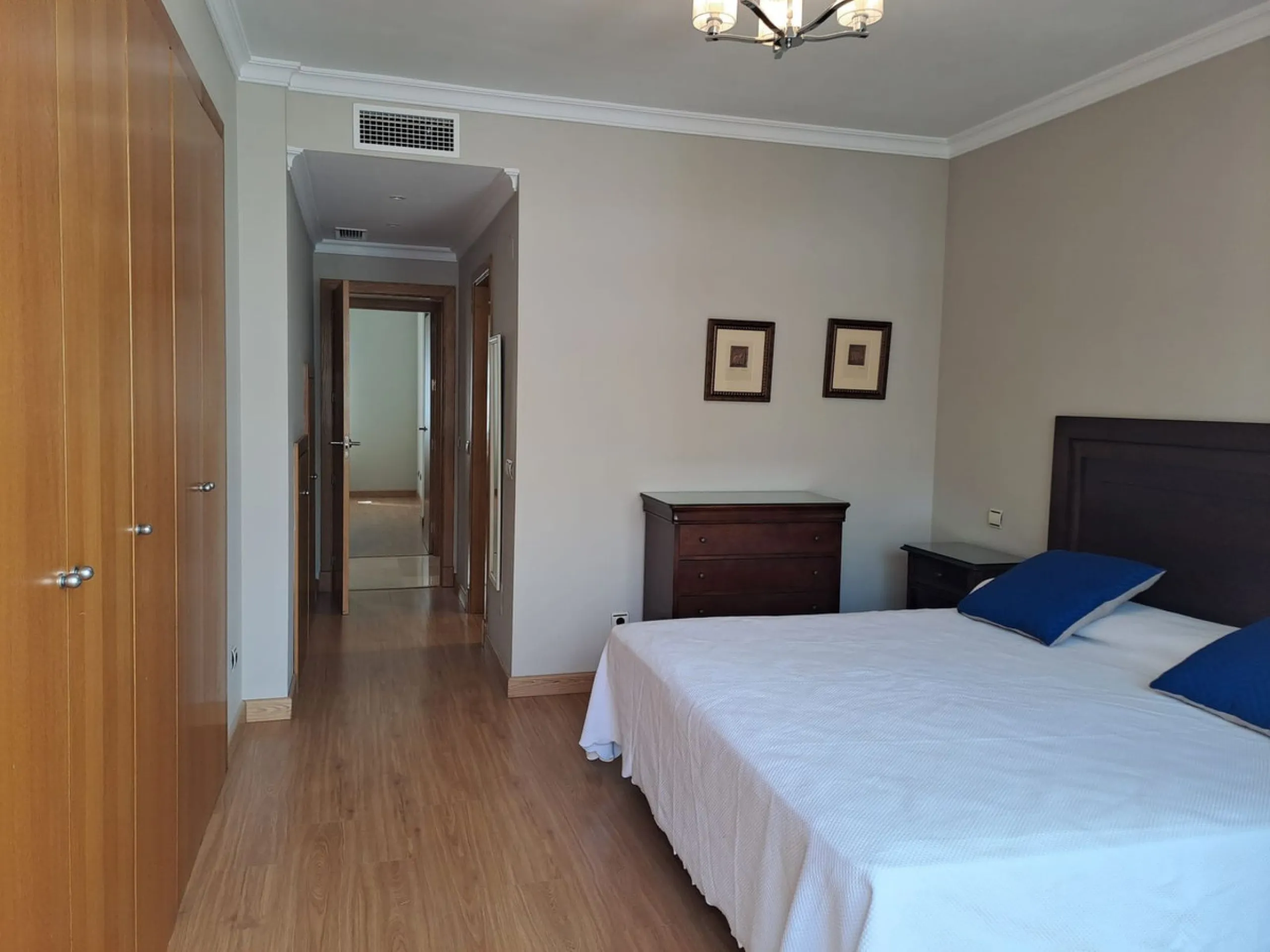 Welcome to this stunning 2-bedroom, 2-bathroom apartment, perfectly situated in a gated community that offers both comfort and convenience. As you step inside, a small hallway leads you to a spacious open-plan living room that connects to a grand solarium