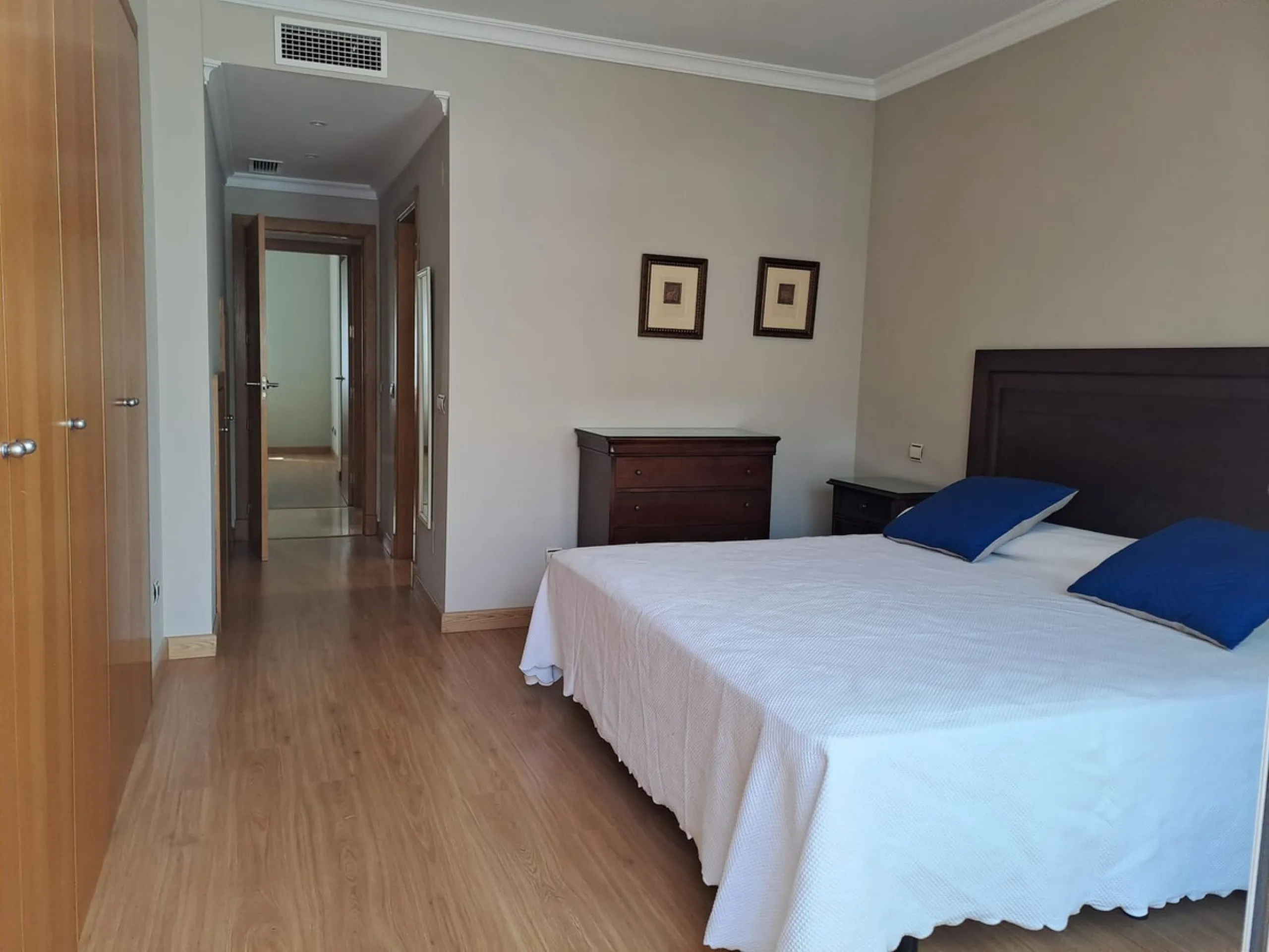 Welcome to this stunning 2-bedroom, 2-bathroom apartment, perfectly situated in a gated community that offers both comfort and convenience. As you step inside, a small hallway leads you to a spacious open-plan living room that connects to a grand solarium