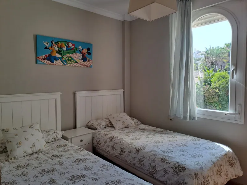 Welcome to this stunning 2-bedroom, 2-bathroom apartment, perfectly situated in a gated community that offers both comfort and convenience. As you step inside, a small hallway leads you to a spacious open-plan living room that connects to a grand solarium