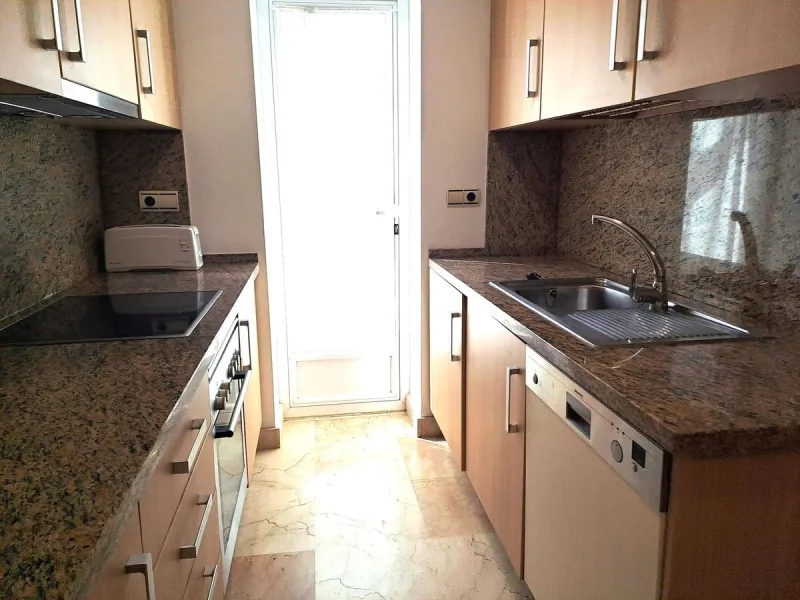 Welcome to this stunning 2-bedroom, 2-bathroom apartment, perfectly situated in a gated community that offers both comfort and convenience. As you step inside, a small hallway leads you to a spacious open-plan living room that connects to a grand solarium
