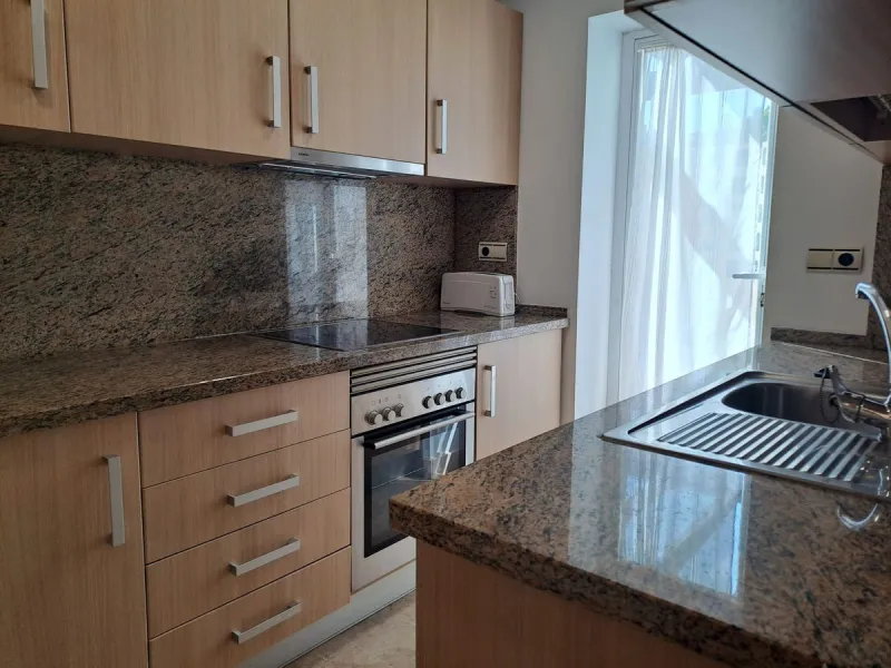 Welcome to this stunning 2-bedroom, 2-bathroom apartment, perfectly situated in a gated community that offers both comfort and convenience. As you step inside, a small hallway leads you to a spacious open-plan living room that connects to a grand solarium