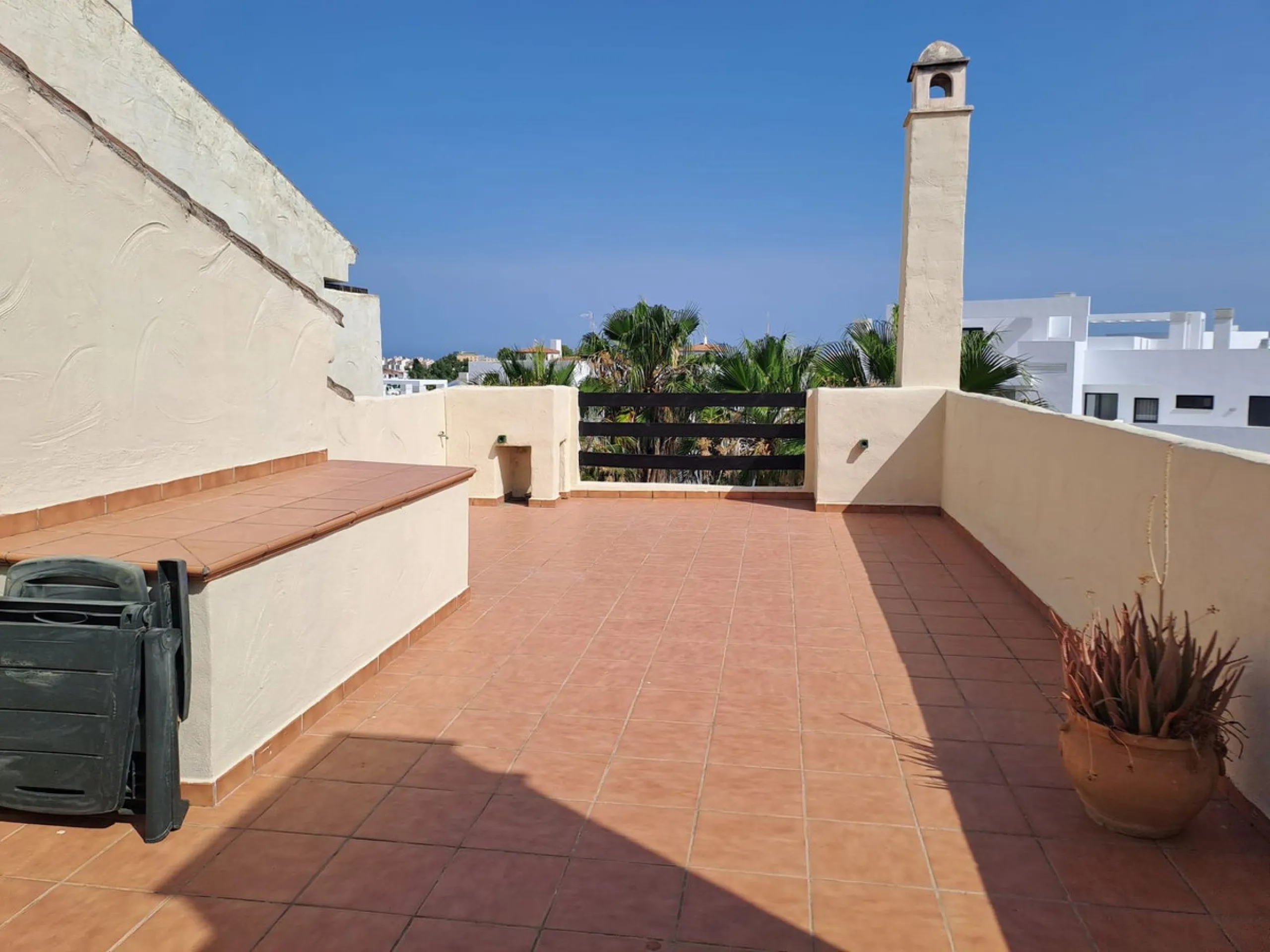 Welcome to this stunning 2-bedroom, 2-bathroom apartment, perfectly situated in a gated community that offers both comfort and convenience. As you step inside, a small hallway leads you to a spacious open-plan living room that connects to a grand solarium