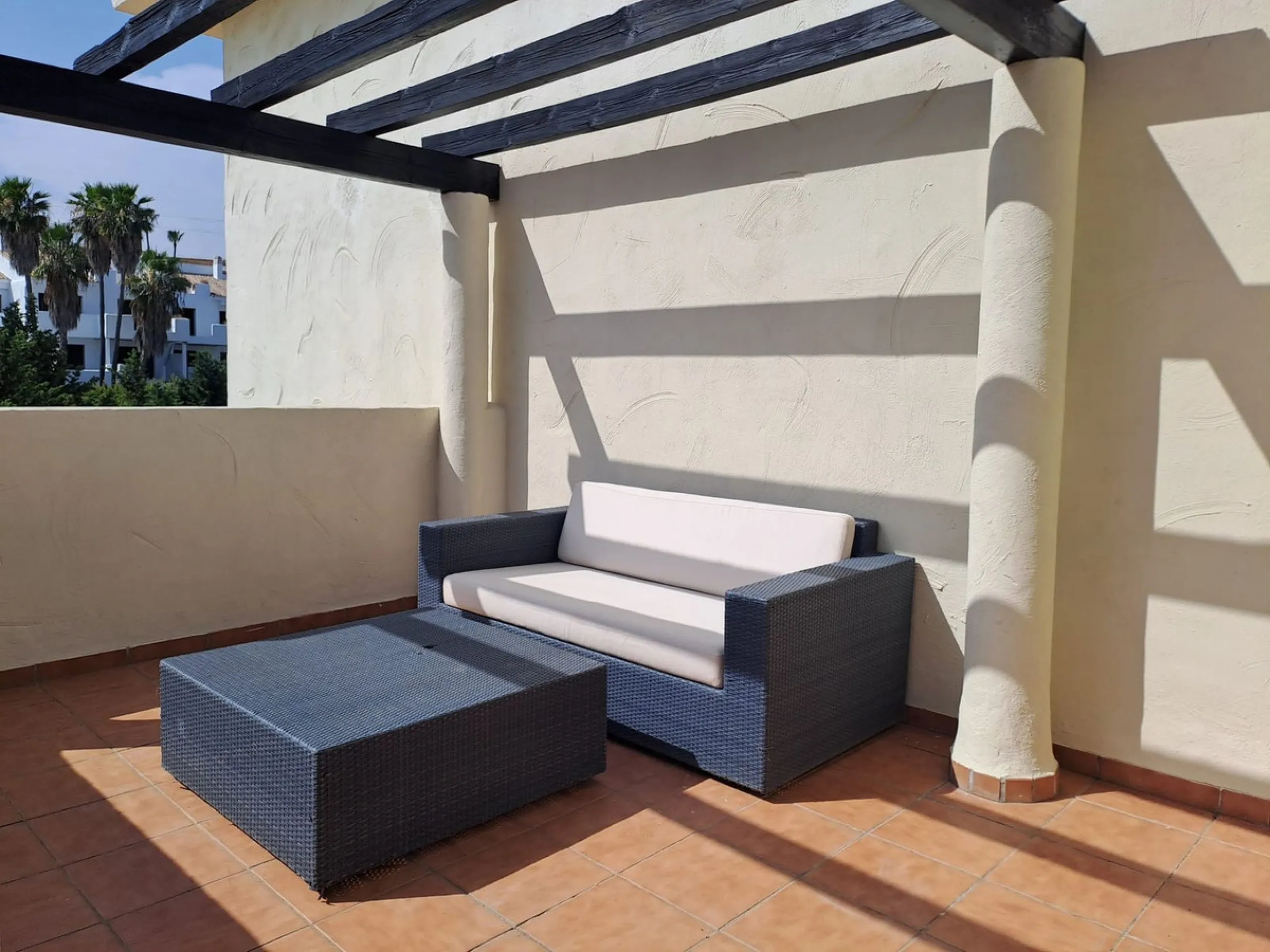 Welcome to this stunning 2-bedroom, 2-bathroom apartment, perfectly situated in a gated community that offers both comfort and convenience. As you step inside, a small hallway leads you to a spacious open-plan living room that connects to a grand solarium