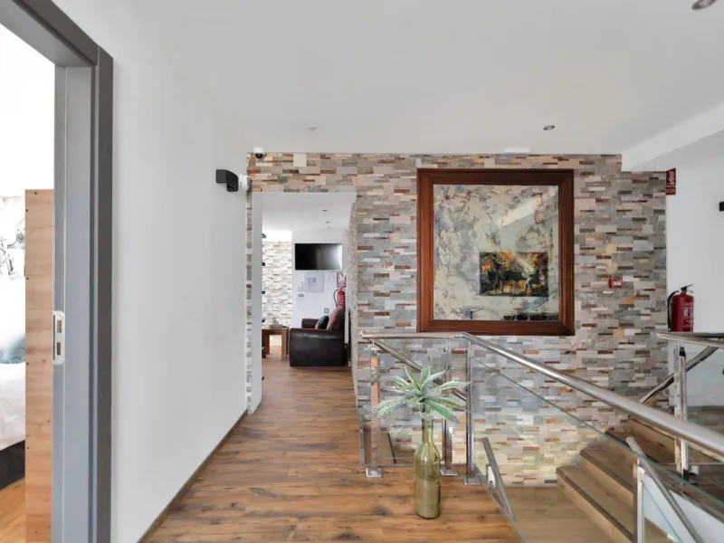 We are thrilled to present a remarkable investment opportunity: a magnificent villa converted into a boutique hotel with tourist licence, just 50 meters from the beach. This property features 16 soundproofed, en-suite rooms, all fully equipped and recentl