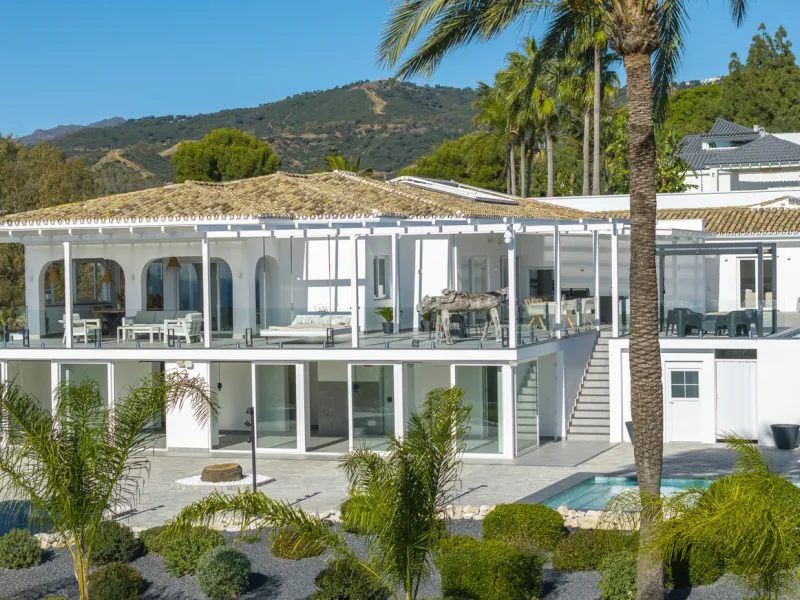 Set on two generous plots totalling 6.128 m², this private and peaceful luxury villa offers a rare blend of modern Mediterranean style and natural beauty in Elviria, Marbella East. Surrounded by its own unspoilt land on one side, the property enjoys excep