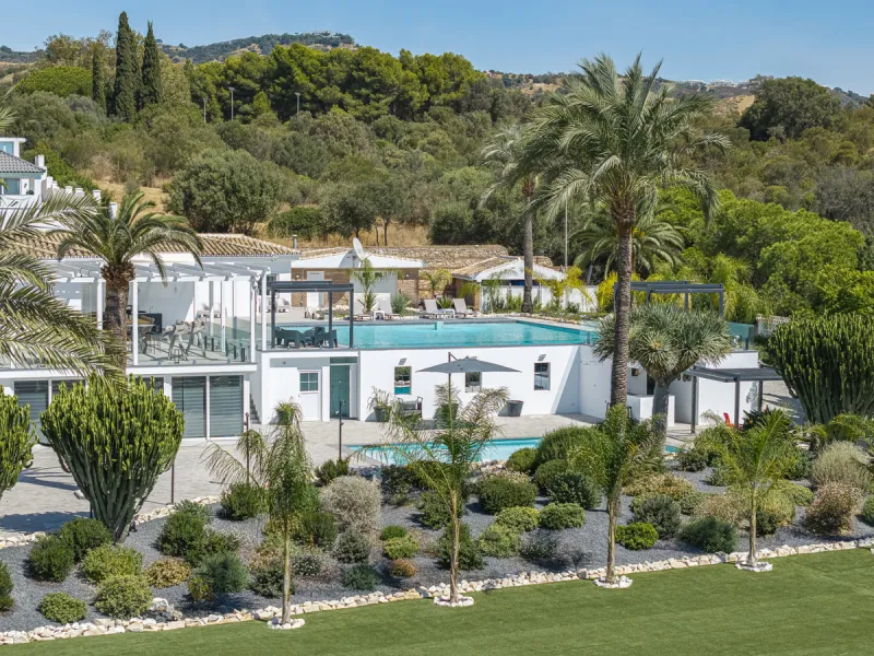 Set on two generous plots totalling 6.128 m², this private and peaceful luxury villa offers a rare blend of modern Mediterranean style and natural beauty in Elviria, Marbella East. Surrounded by its own unspoilt land on one side, the property enjoys excep