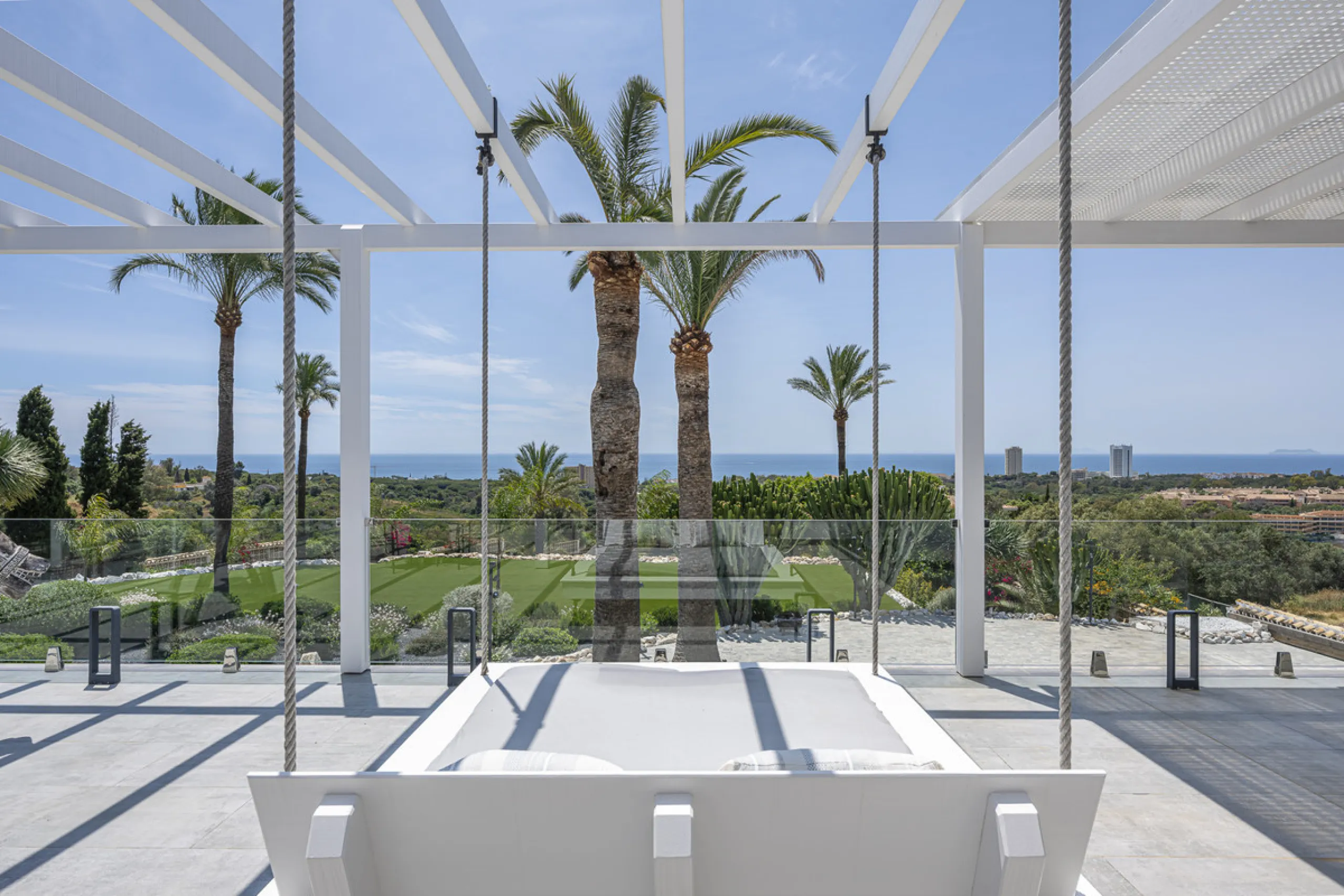 Set on two generous plots totalling 6.128 m², this private and peaceful luxury villa offers a rare blend of modern Mediterranean style and natural beauty in Elviria, Marbella East. Surrounded by its own unspoilt land on one side, the property enjoys excep