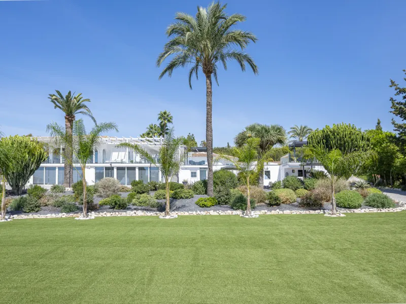 Set on two generous plots totalling 6.128 m², this private and peaceful luxury villa offers a rare blend of modern Mediterranean style and natural beauty in Elviria, Marbella East. Surrounded by its own unspoilt land on one side, the property enjoys excep