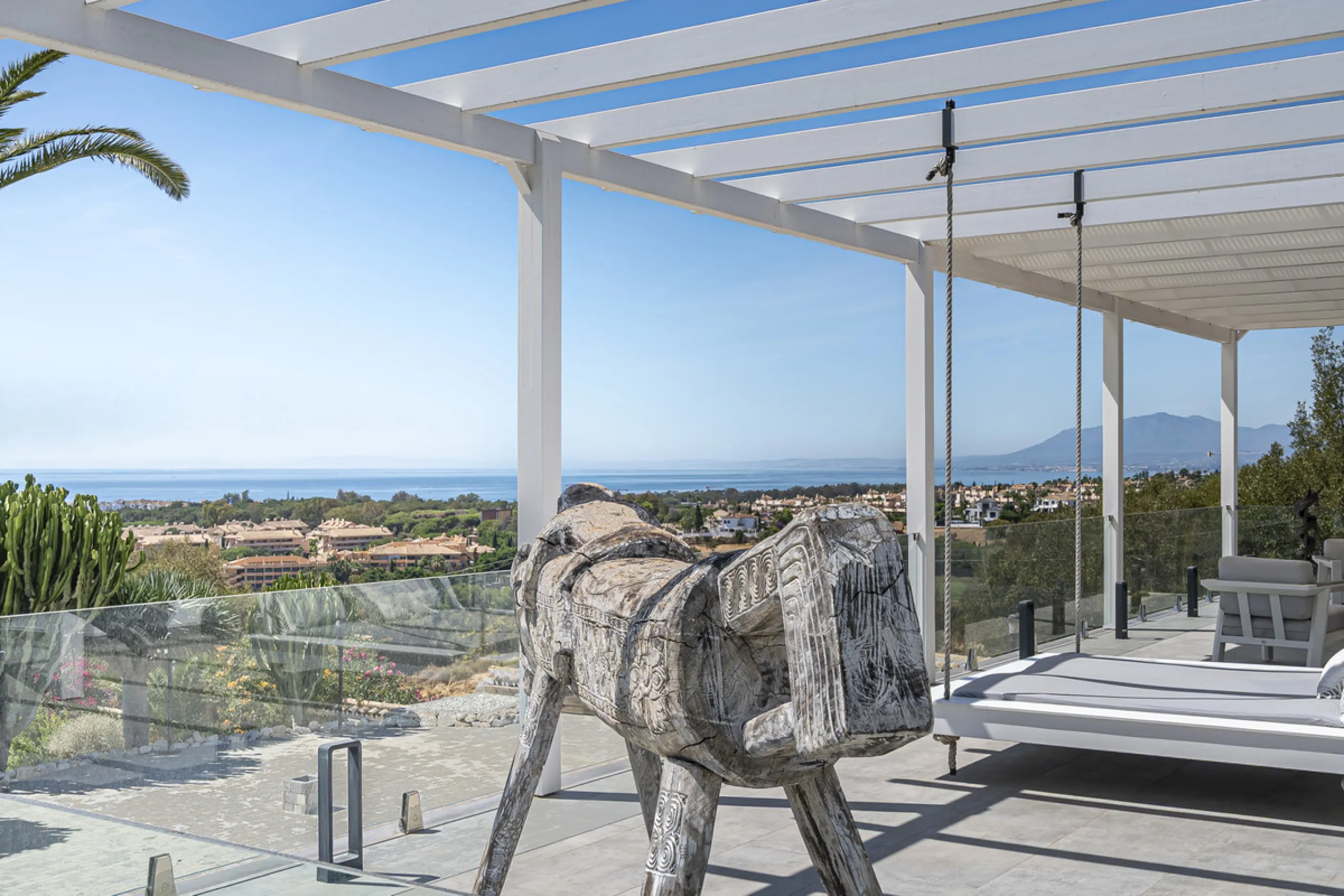 Set on two generous plots totalling 6.128 m², this private and peaceful luxury villa offers a rare blend of modern Mediterranean style and natural beauty in Elviria, Marbella East. Surrounded by its own unspoilt land on one side, the property enjoys excep