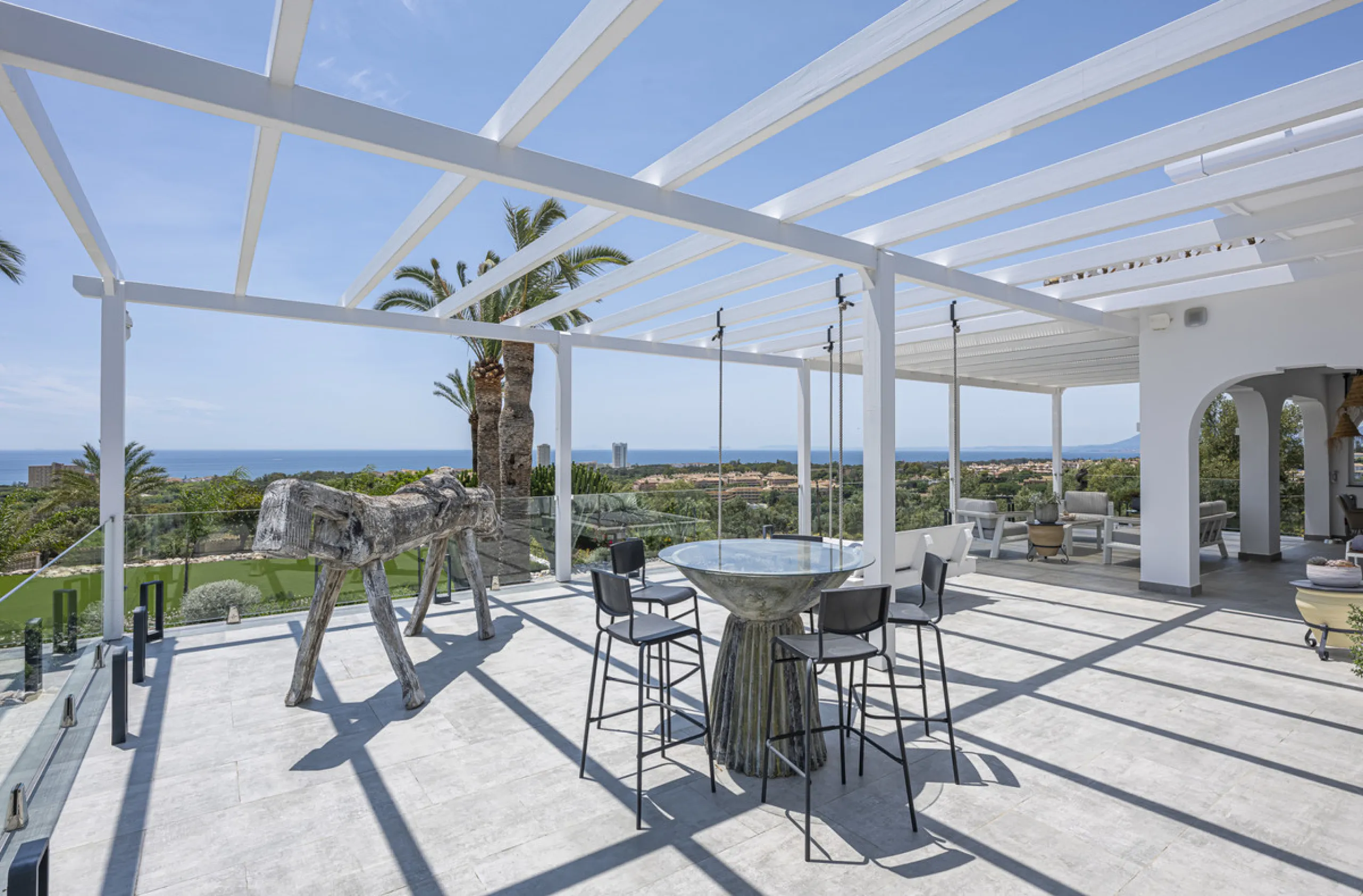 Set on two generous plots totalling 6.128 m², this private and peaceful luxury villa offers a rare blend of modern Mediterranean style and natural beauty in Elviria, Marbella East. Surrounded by its own unspoilt land on one side, the property enjoys excep