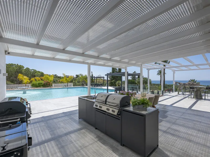 Set on two generous plots totalling 6.128 m², this private and peaceful luxury villa offers a rare blend of modern Mediterranean style and natural beauty in Elviria, Marbella East. Surrounded by its own unspoilt land on one side, the property enjoys excep