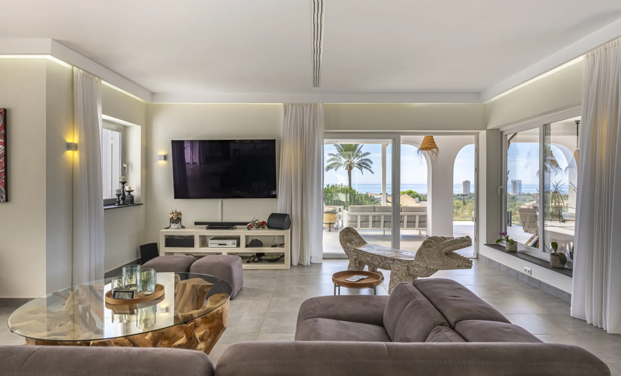 Set on two generous plots totalling 6.128 m², this private and peaceful luxury villa offers a rare blend of modern Mediterranean style and natural beauty in Elviria, Marbella East. Surrounded by its own unspoilt land on one side, the property enjoys excep