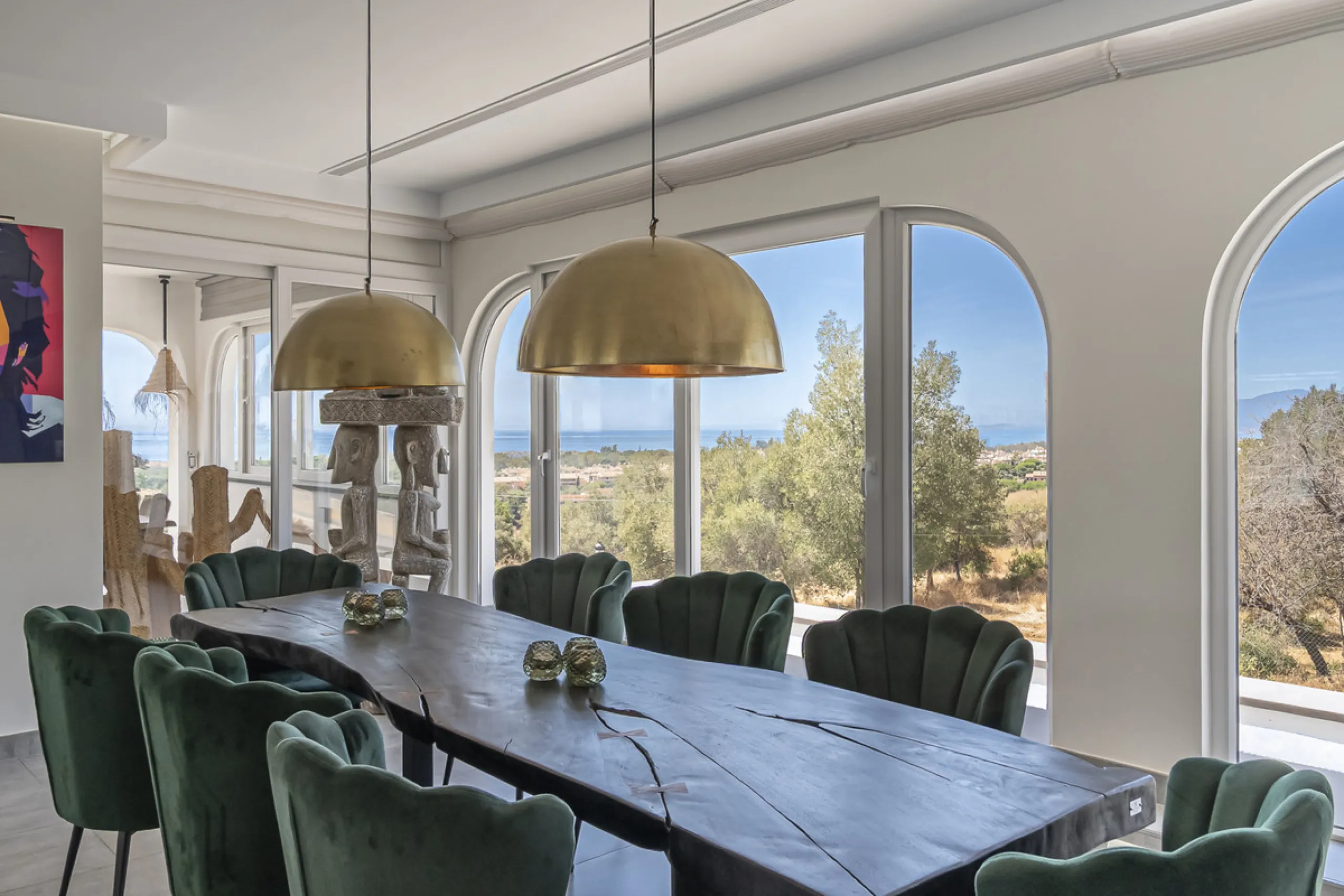 Set on two generous plots totalling 6.128 m², this private and peaceful luxury villa offers a rare blend of modern Mediterranean style and natural beauty in Elviria, Marbella East. Surrounded by its own unspoilt land on one side, the property enjoys excep