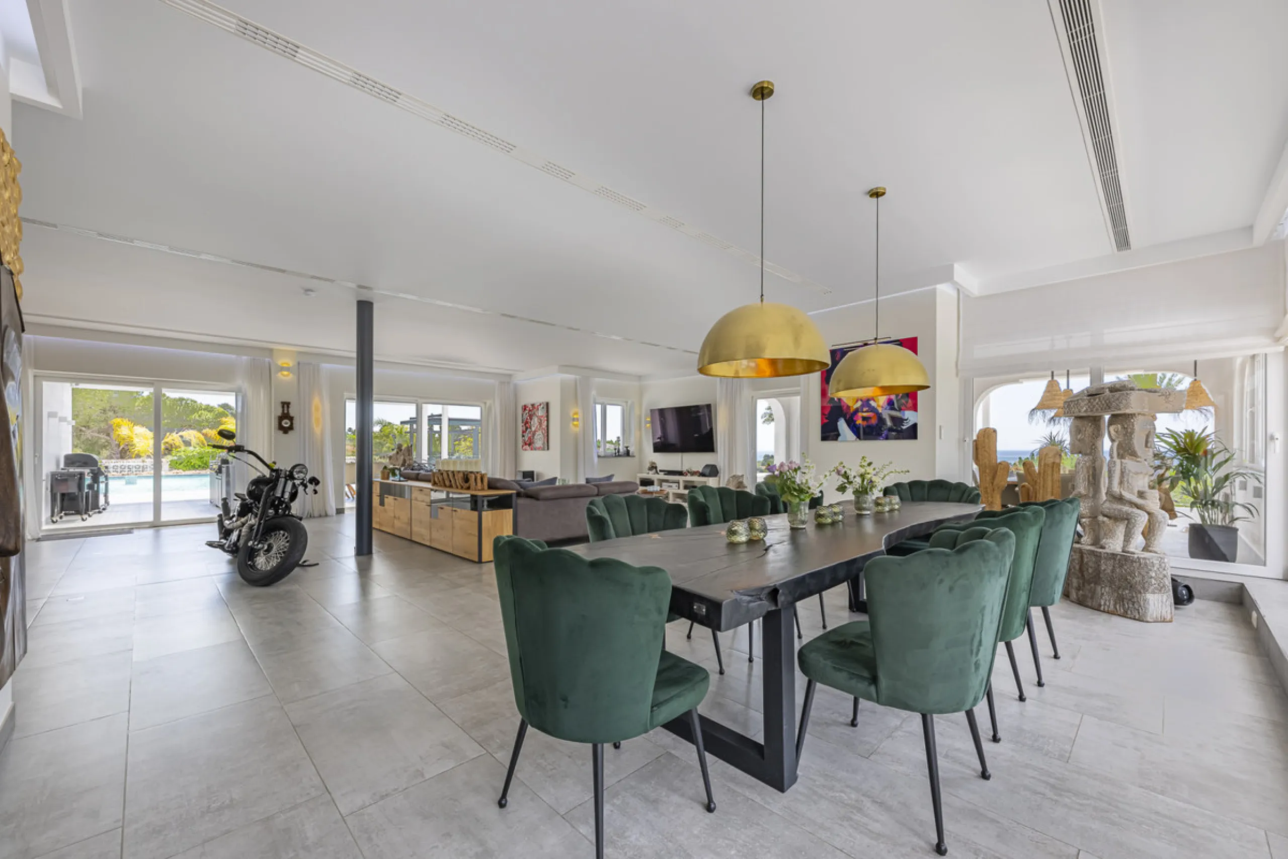 Set on two generous plots totalling 6.128 m², this private and peaceful luxury villa offers a rare blend of modern Mediterranean style and natural beauty in Elviria, Marbella East. Surrounded by its own unspoilt land on one side, the property enjoys excep