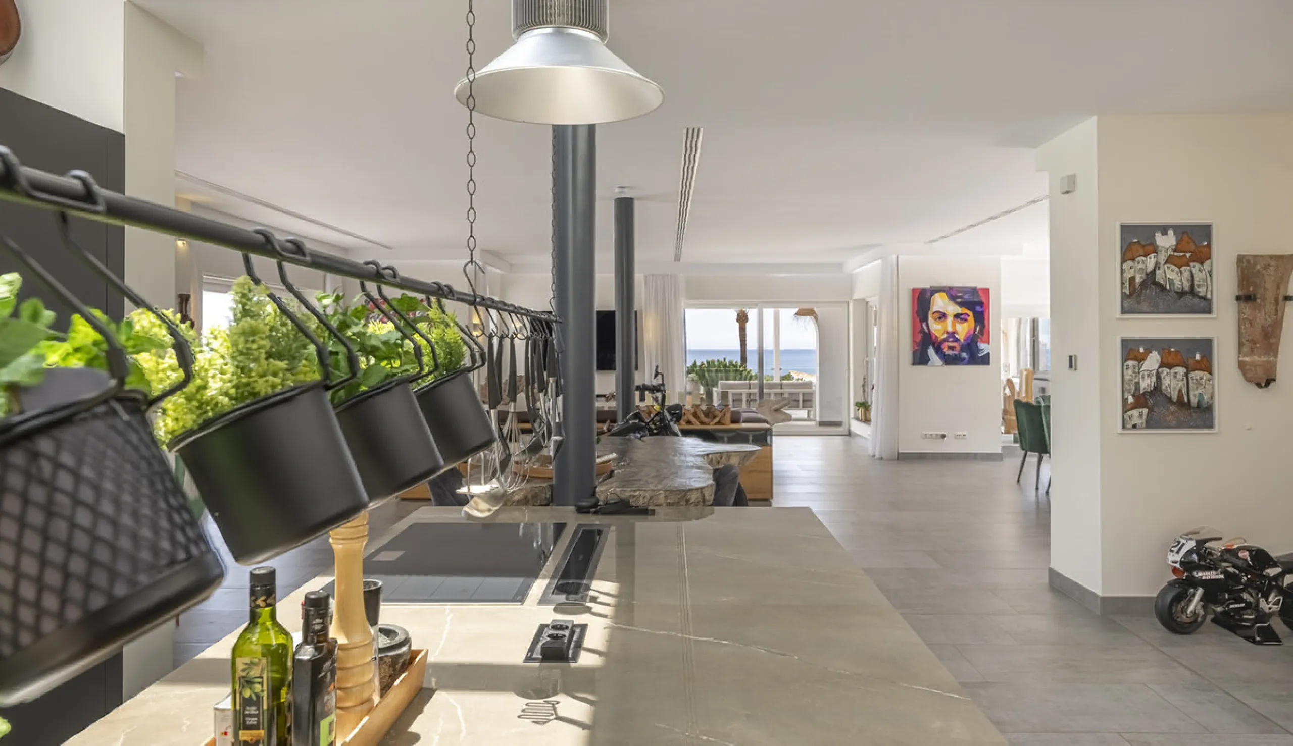 Set on two generous plots totalling 6.128 m², this private and peaceful luxury villa offers a rare blend of modern Mediterranean style and natural beauty in Elviria, Marbella East. Surrounded by its own unspoilt land on one side, the property enjoys excep