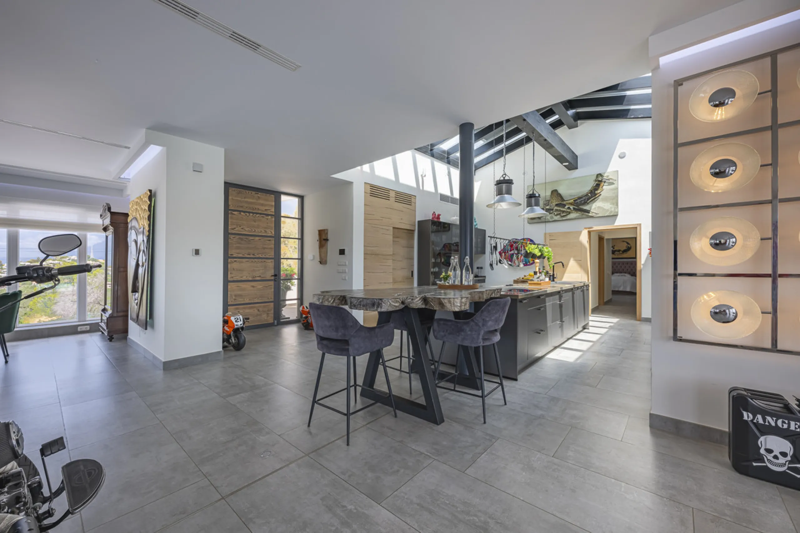 Set on two generous plots totalling 6.128 m², this private and peaceful luxury villa offers a rare blend of modern Mediterranean style and natural beauty in Elviria, Marbella East. Surrounded by its own unspoilt land on one side, the property enjoys excep