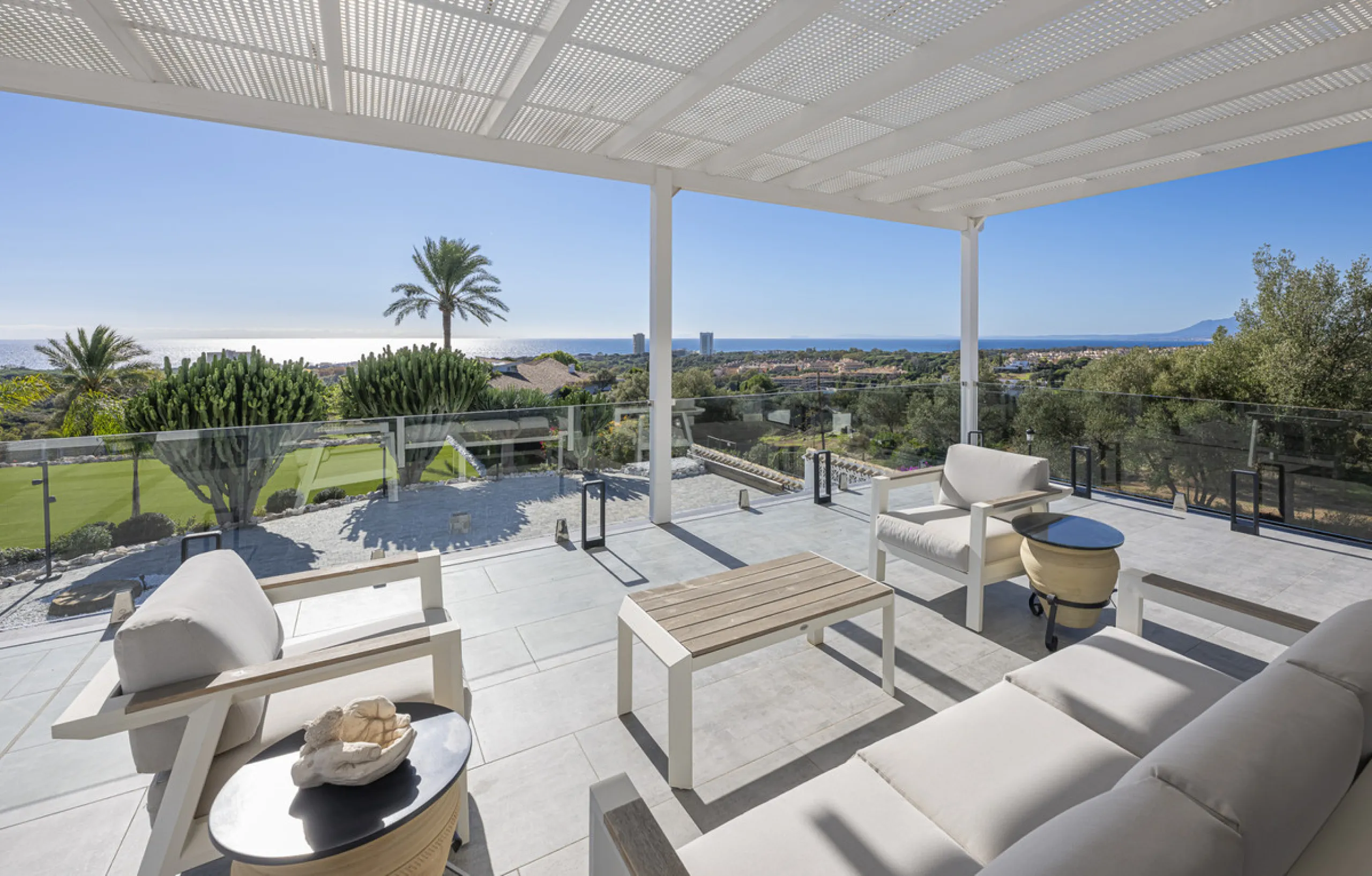 Set on two generous plots totalling 6.128 m², this private and peaceful luxury villa offers a rare blend of modern Mediterranean style and natural beauty in Elviria, Marbella East. Surrounded by its own unspoilt land on one side, the property enjoys excep