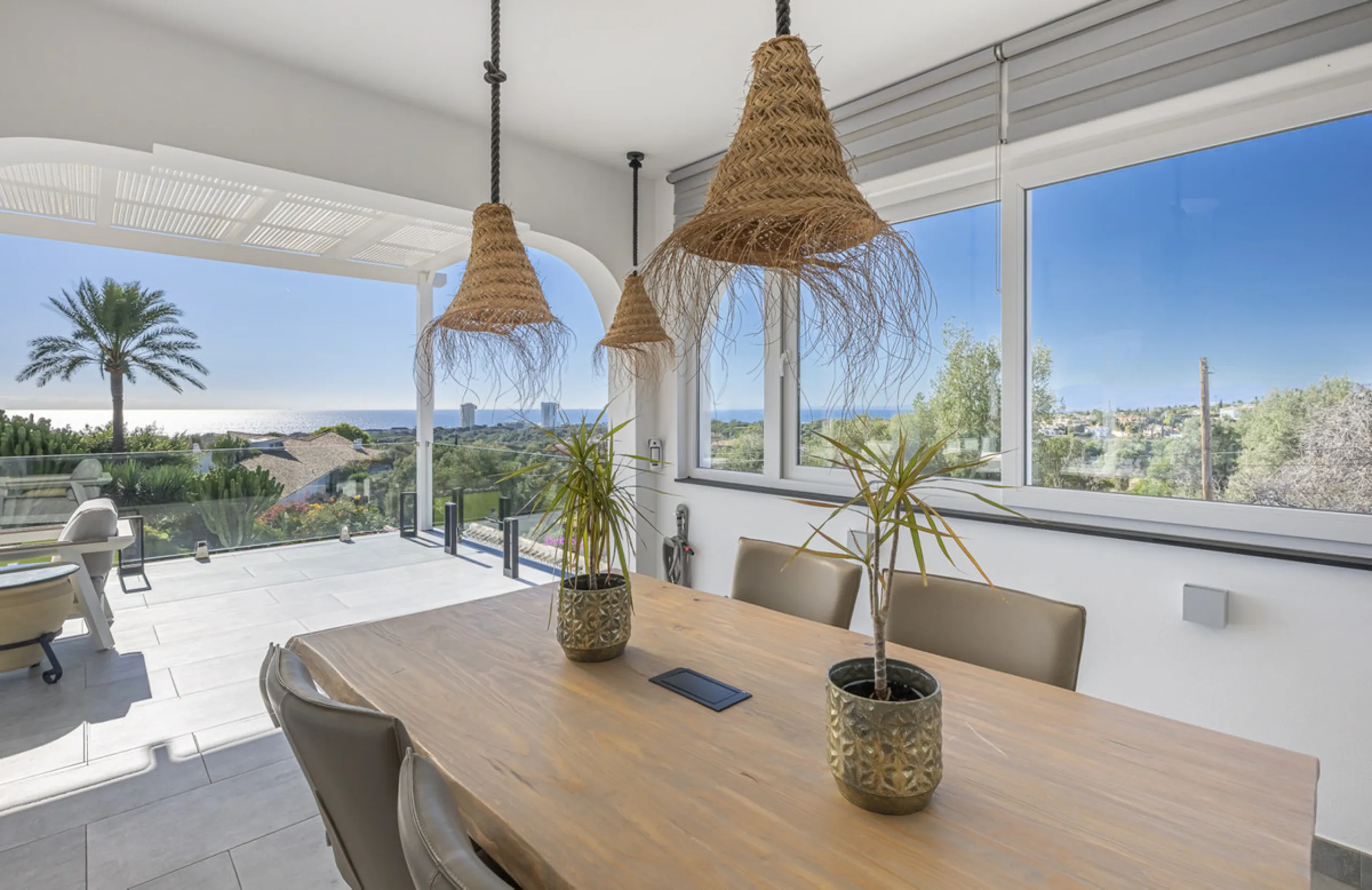 Set on two generous plots totalling 6.128 m², this private and peaceful luxury villa offers a rare blend of modern Mediterranean style and natural beauty in Elviria, Marbella East. Surrounded by its own unspoilt land on one side, the property enjoys excep