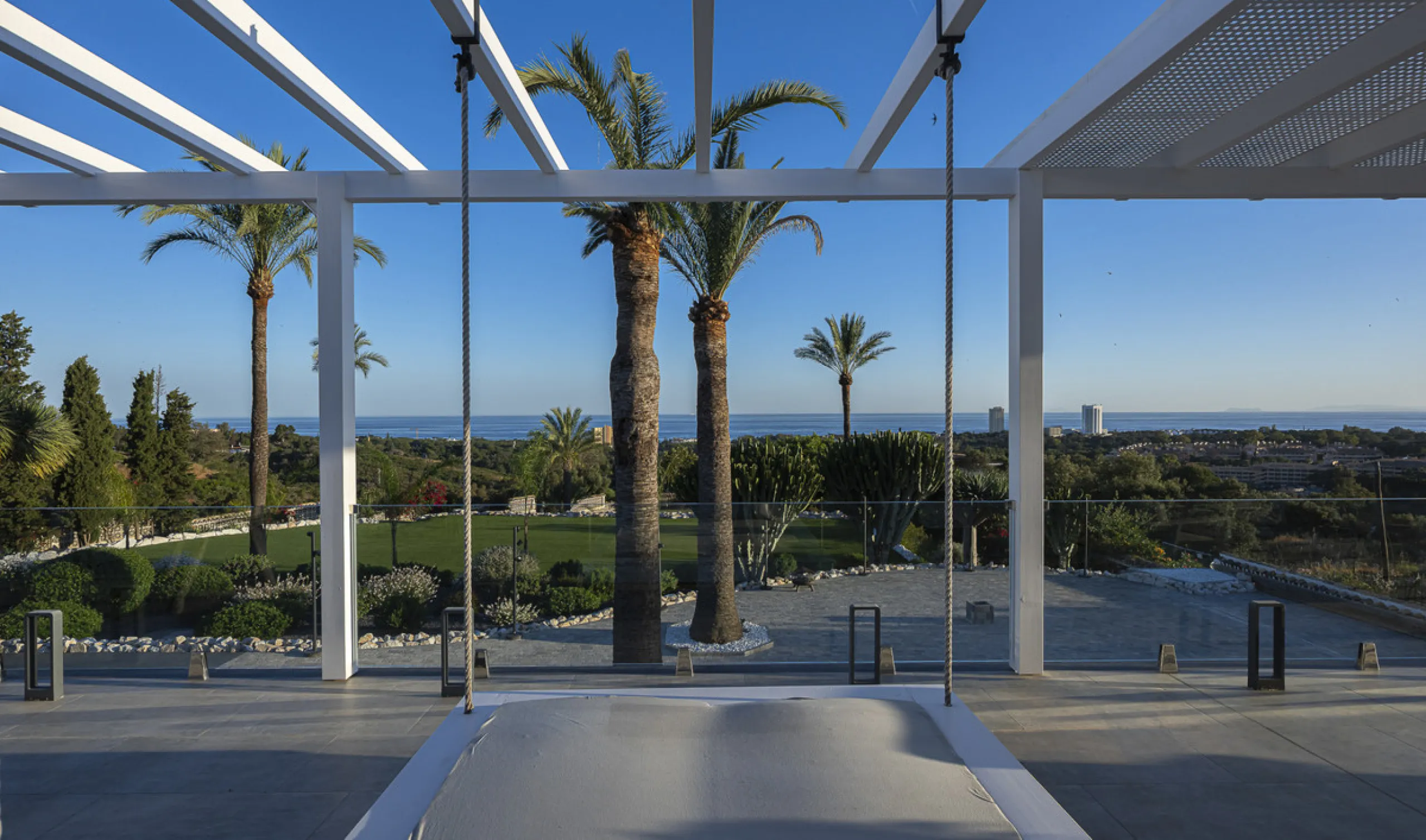 Set on two generous plots totalling 6.128 m², this private and peaceful luxury villa offers a rare blend of modern Mediterranean style and natural beauty in Elviria, Marbella East. Surrounded by its own unspoilt land on one side, the property enjoys excep