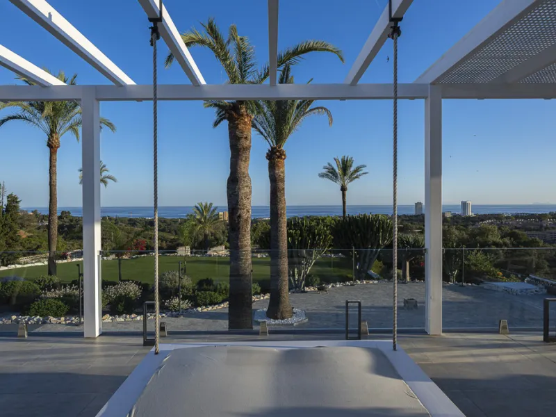 Set on two generous plots totalling 6.128 m², this private and peaceful luxury villa offers a rare blend of modern Mediterranean style and natural beauty in Elviria, Marbella East. Surrounded by its own unspoilt land on one side, the property enjoys excep