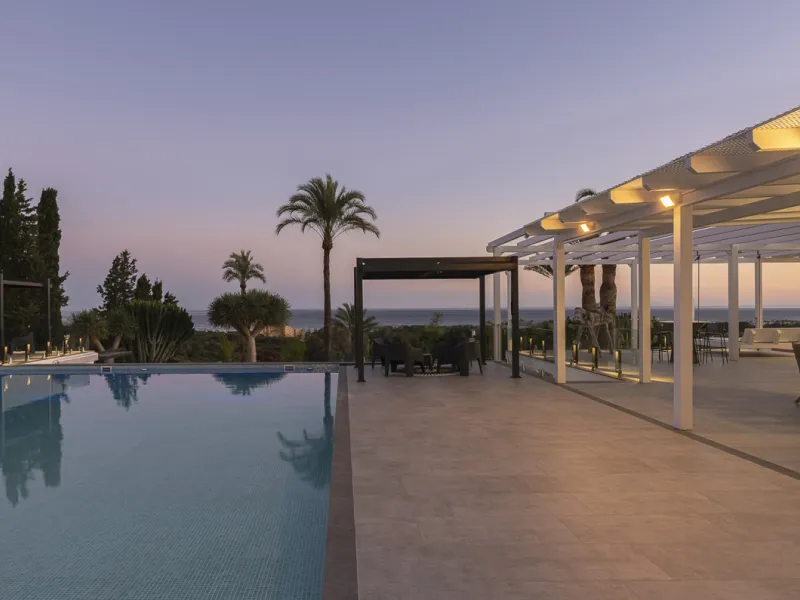 Set on two generous plots totalling 6.128 m², this private and peaceful luxury villa offers a rare blend of modern Mediterranean style and natural beauty in Elviria, Marbella East. Surrounded by its own unspoilt land on one side, the property enjoys excep